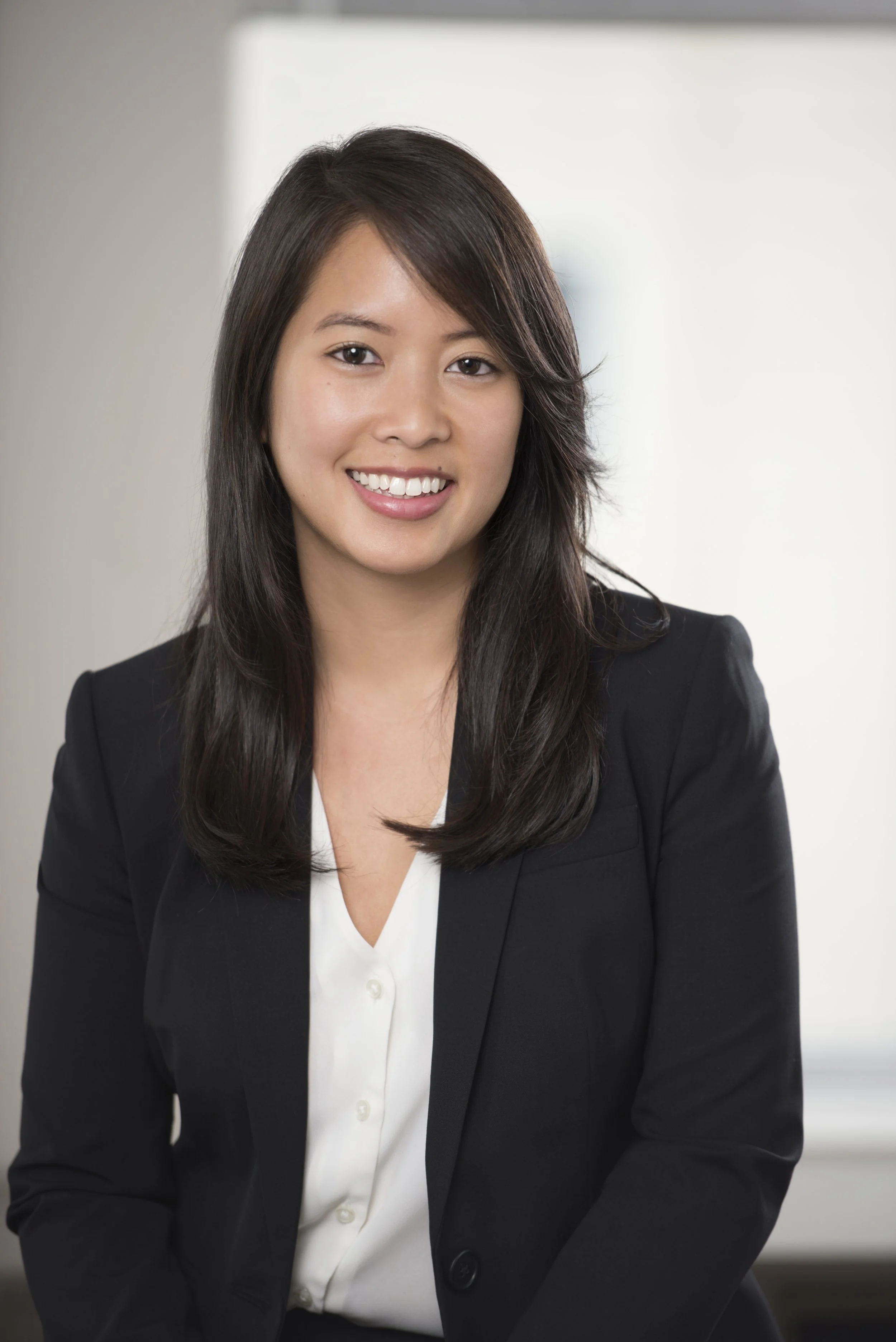 Taken by a top Chicago portrait photographer, this photo is of an attorney. The firm will use the photo to promote their company online for their client-facing website. This is a modern, clean, bright portrait of a woman.