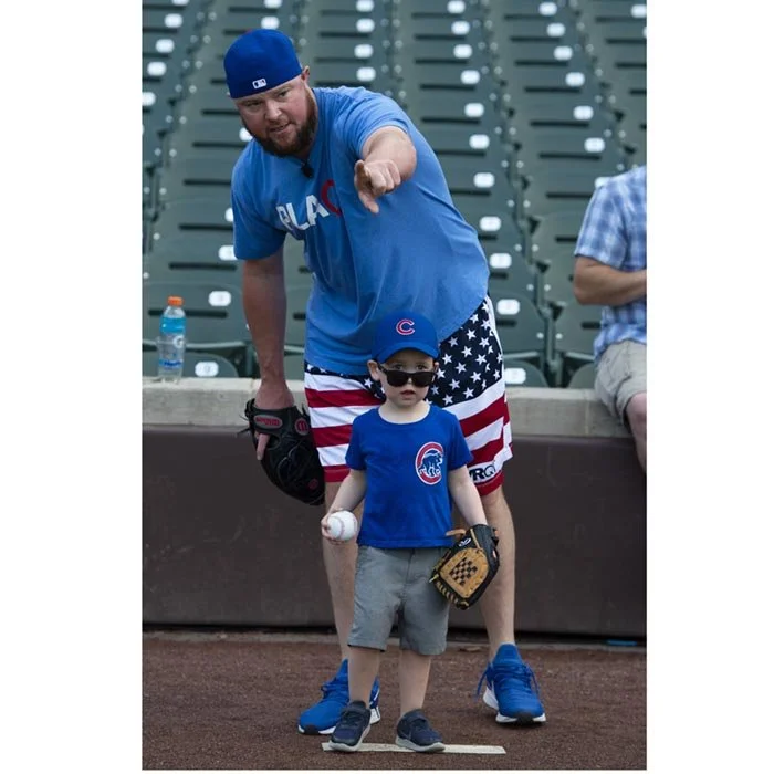 Annual Cubs fundraiser where the pitcher is teaching children. Captured by an event photographer for marketing.