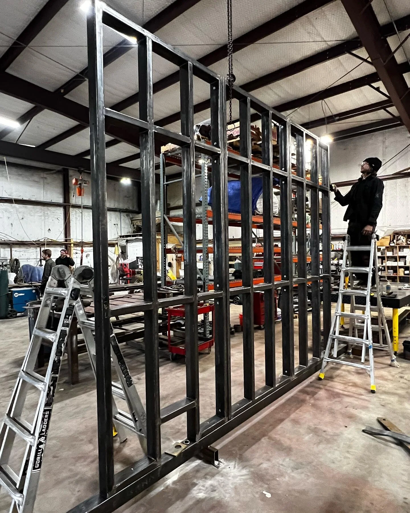 New large pivot wall assembly coming together in the shop.  @stonefoxarch #austin #architecture #fabrication #steel #welding #operable