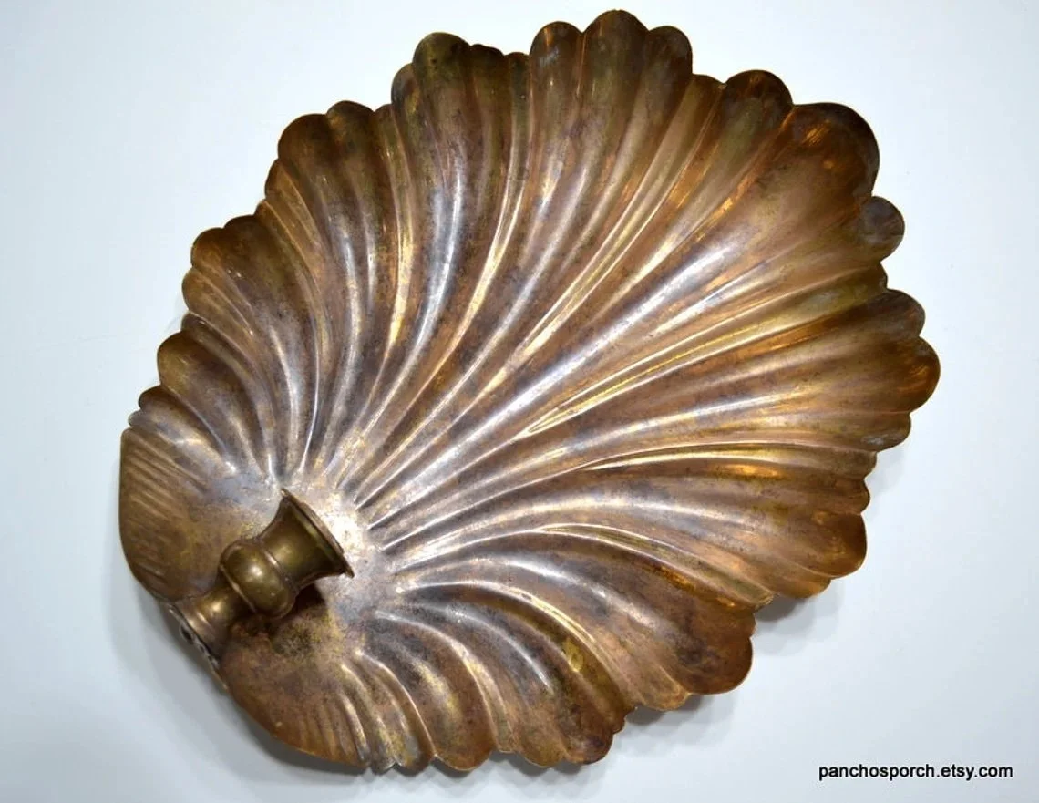 Vintage Large Brass Copper Shell Candle Wall Sconce ($47.96 at Etsy)