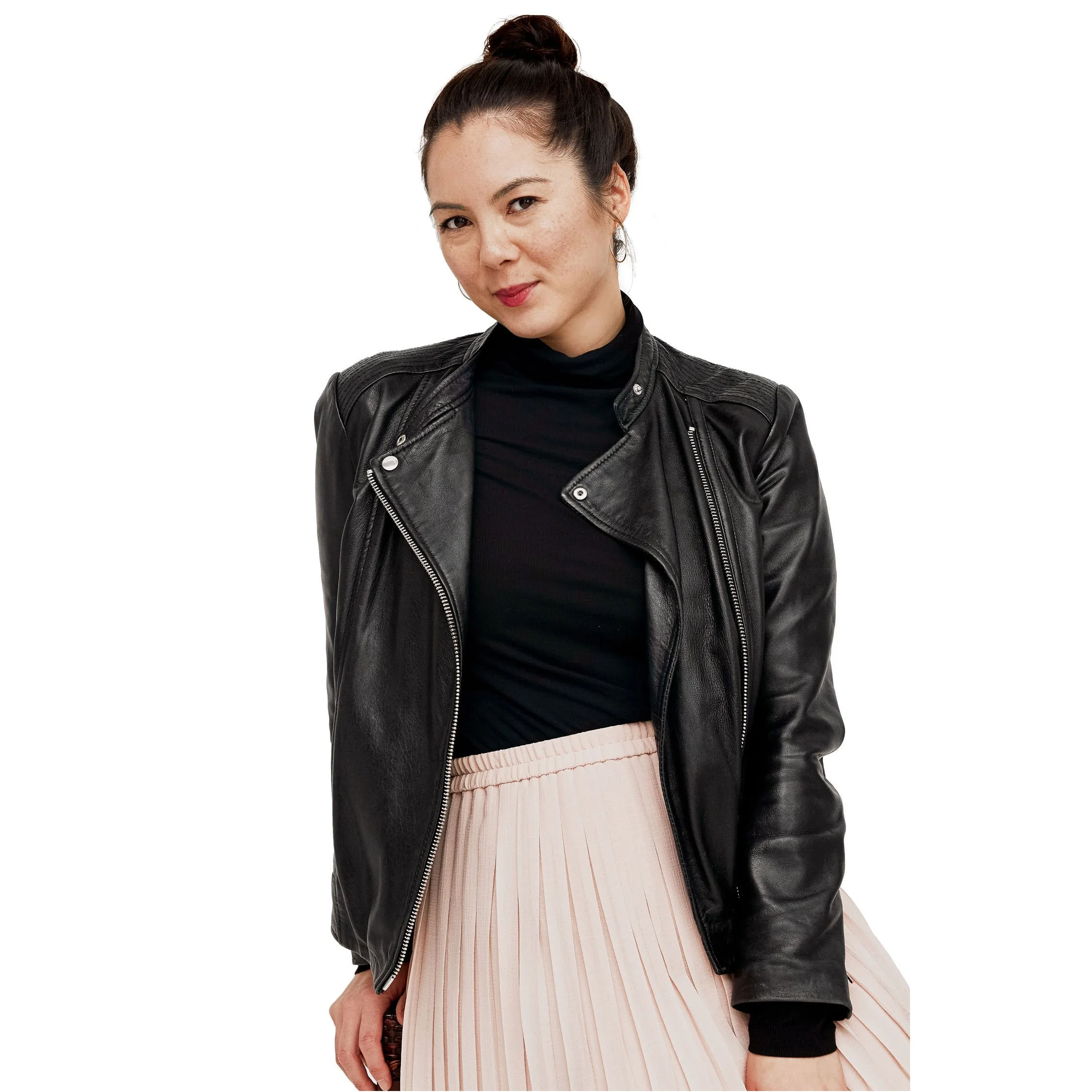Jasmin wearing pleated pink skirt and black jacket