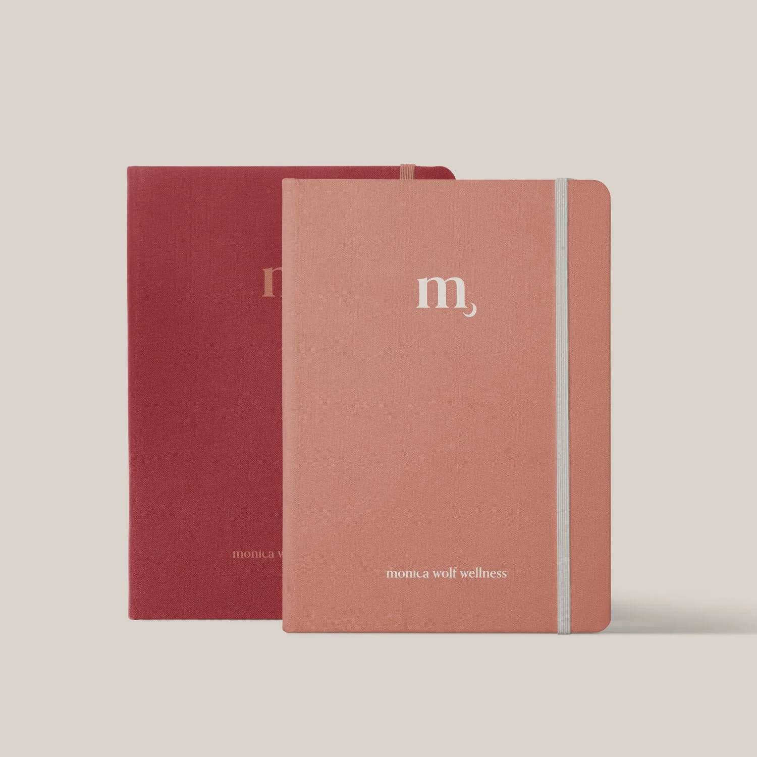 monica wolf wellness logo on notebook