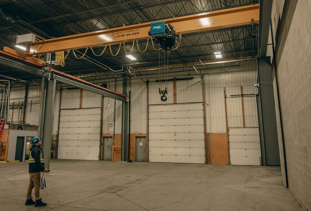 overhead crane and hoist with bay door in the background