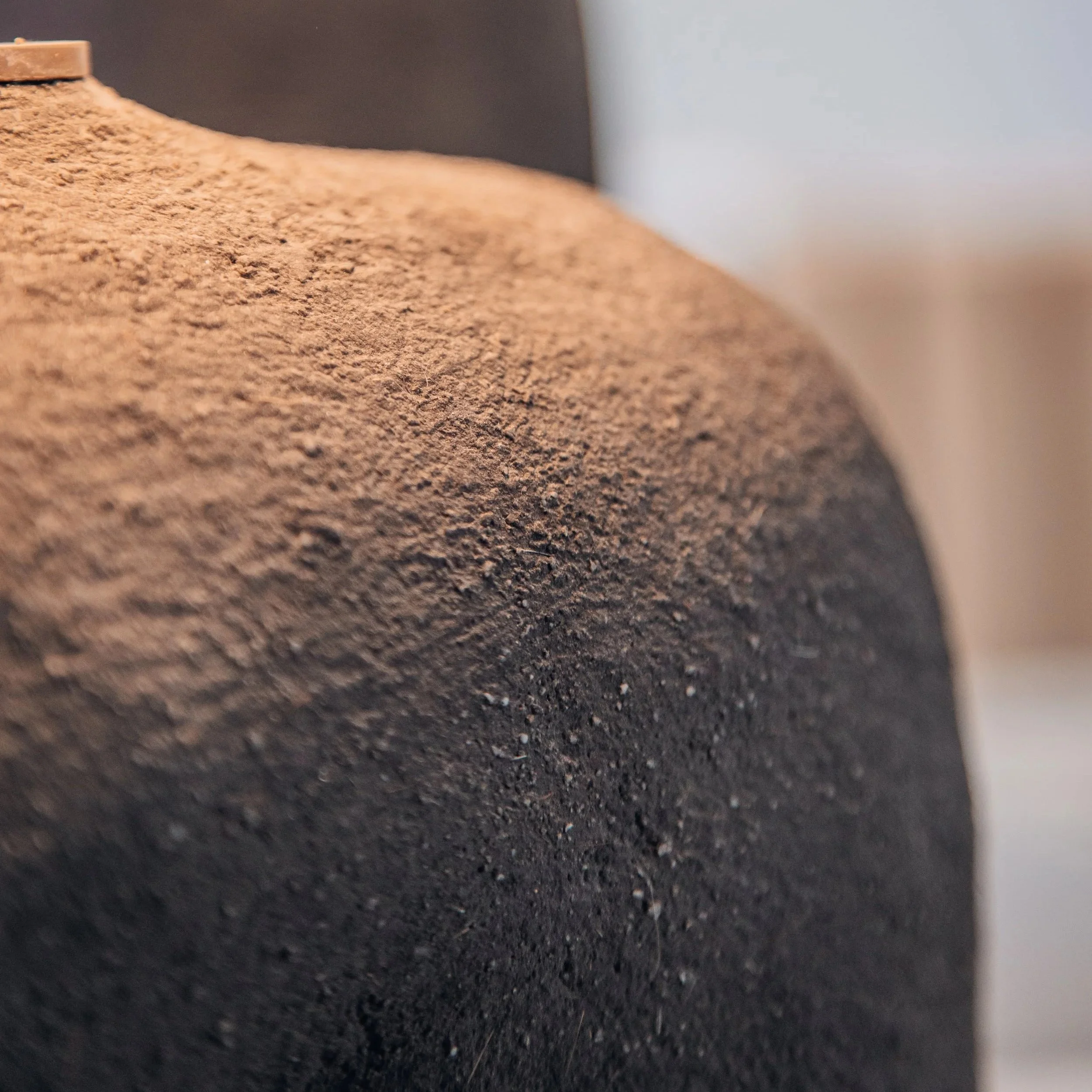 Close-up of the Philokalia cob lamp by Studio Vourli, highlighting its organic hand-shaped form and sculptural materiality.