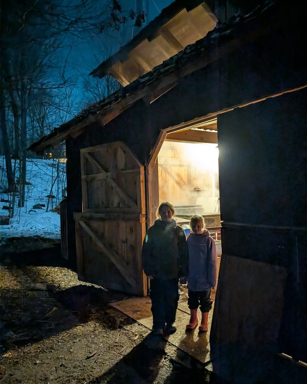 Boiling maple sap late into the evening.