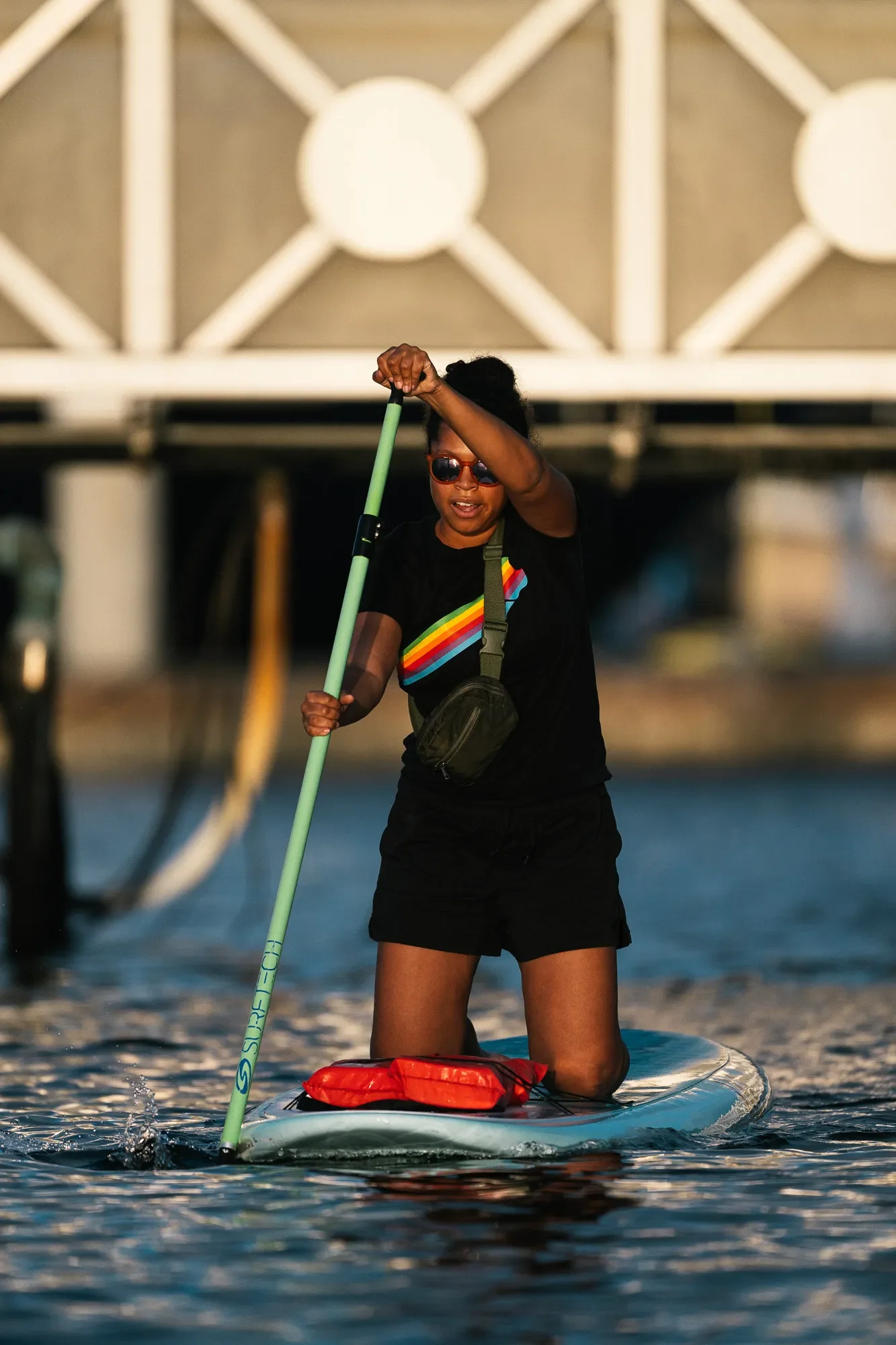 Woman Paddles through the residential basins on a Sunset Paddle Cruise at Pro SUP Shop