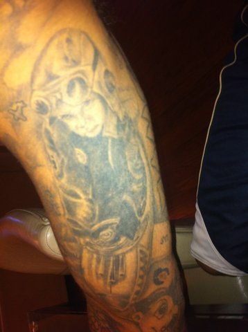 Royalty lettering tattoo on Chris Browns shin for