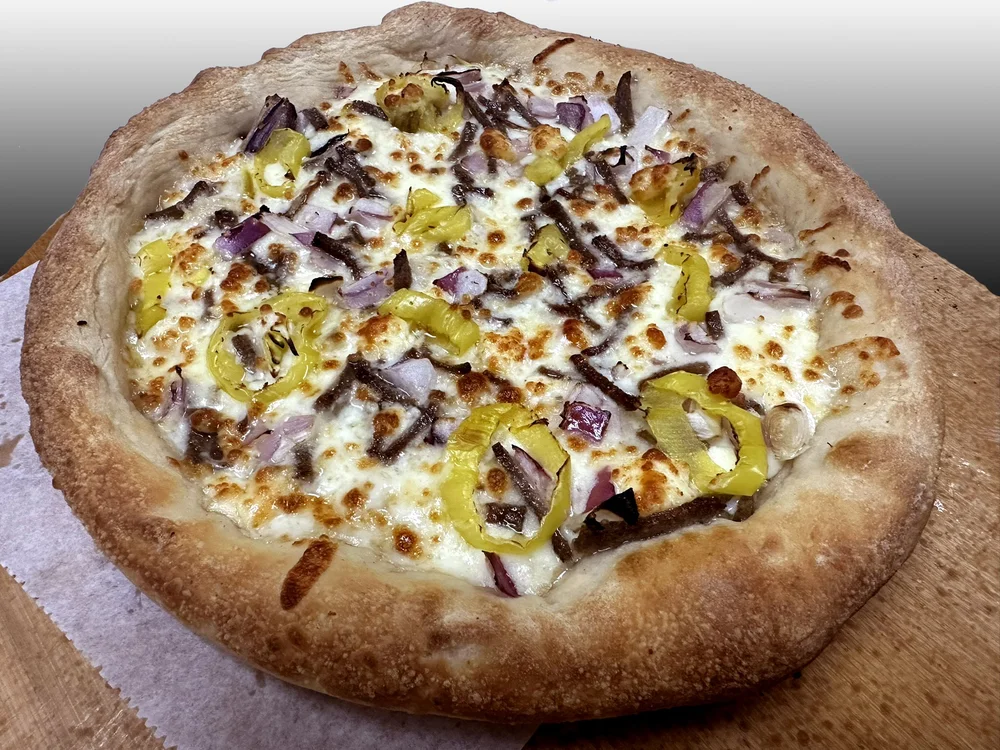 Gyro pizza with cheese and toppings