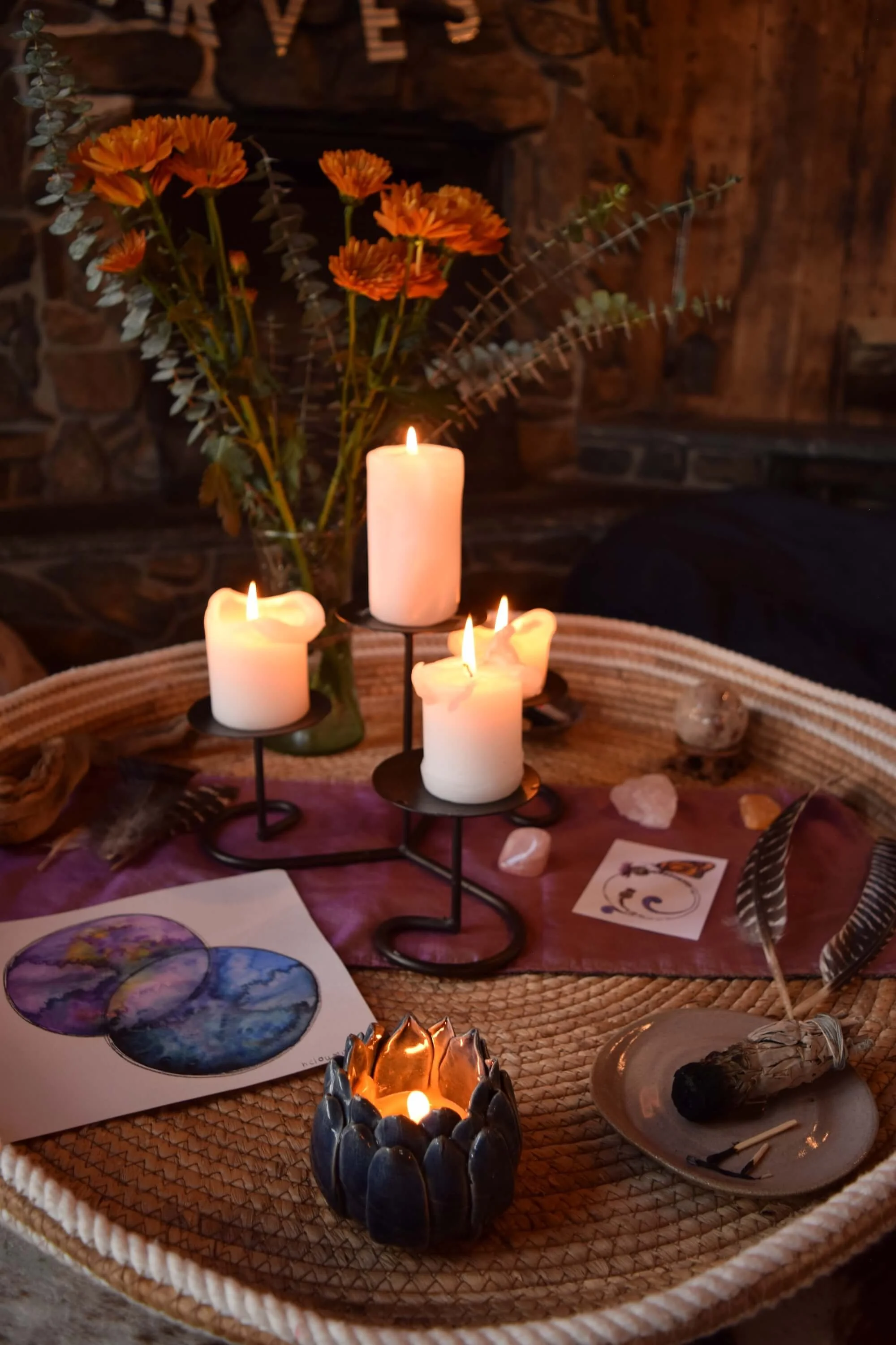 A display of candles, flowers, and altar items