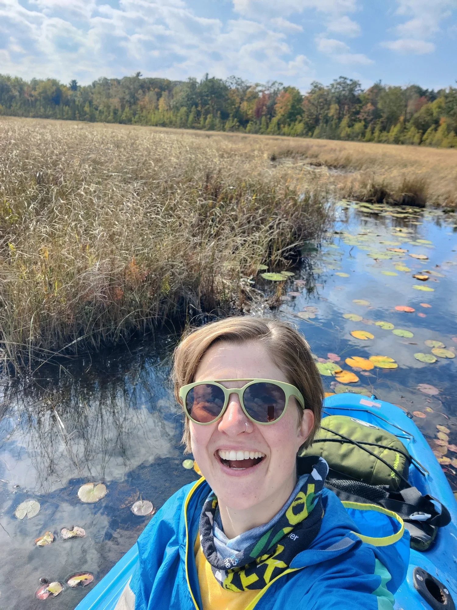 Arielle smiles in a kayak