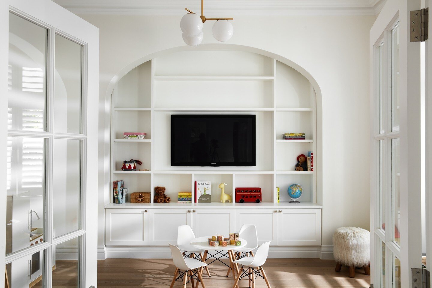 The cutest playroom around! Our built-in cabinetry encased within an existing arch features an abundance of (toys!) storage. ⁠
⁠
Design @march_twice_interiors⁠
Build @built.by.dezign⁠
Joinery @janzdesigns⁠
Photography @ryanlphoto