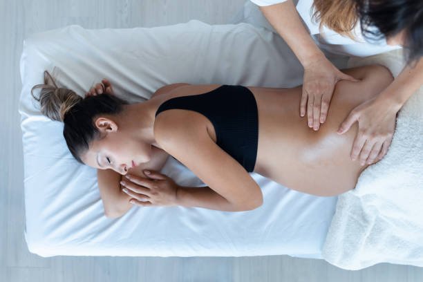 Client receiving a therapeutic massage session.