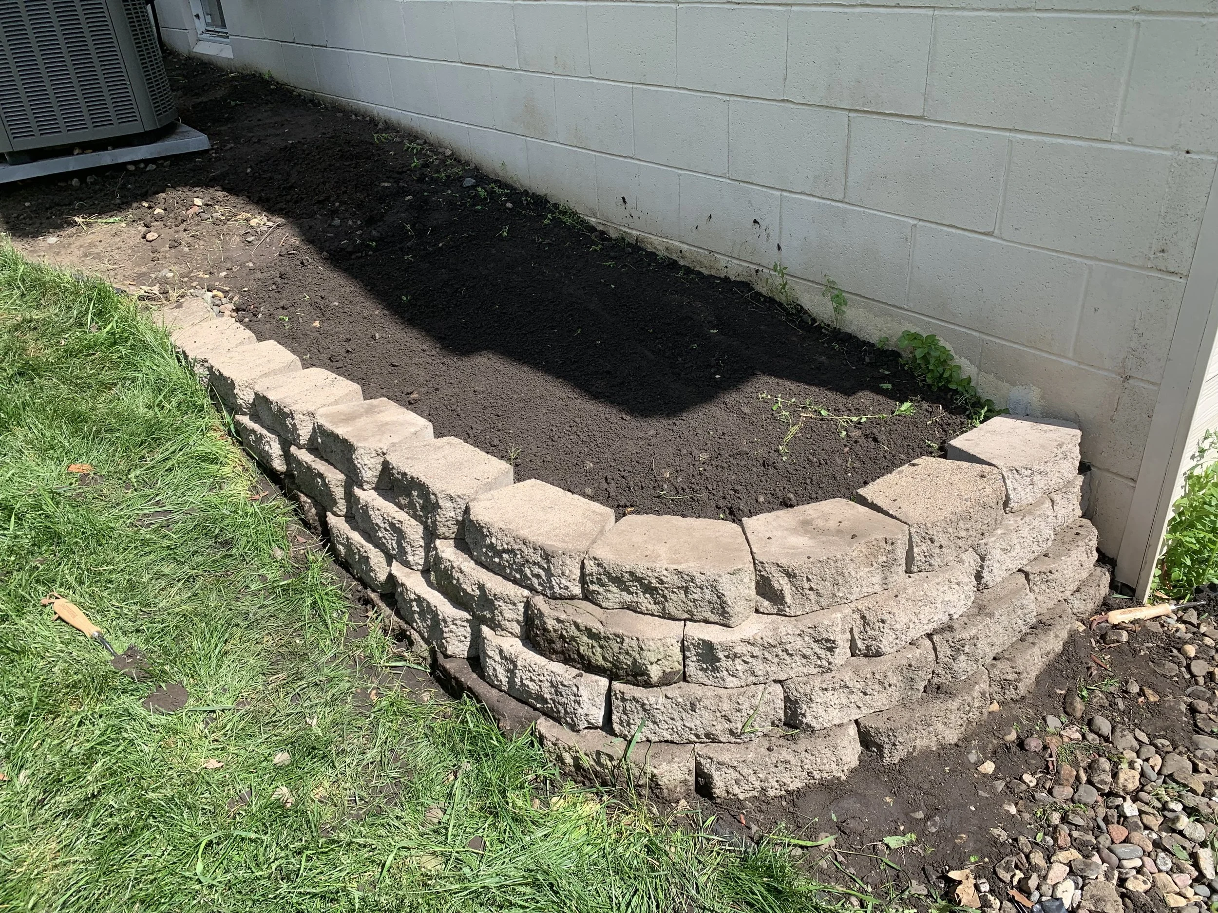 Rocks removed & Retaining Wall restored!