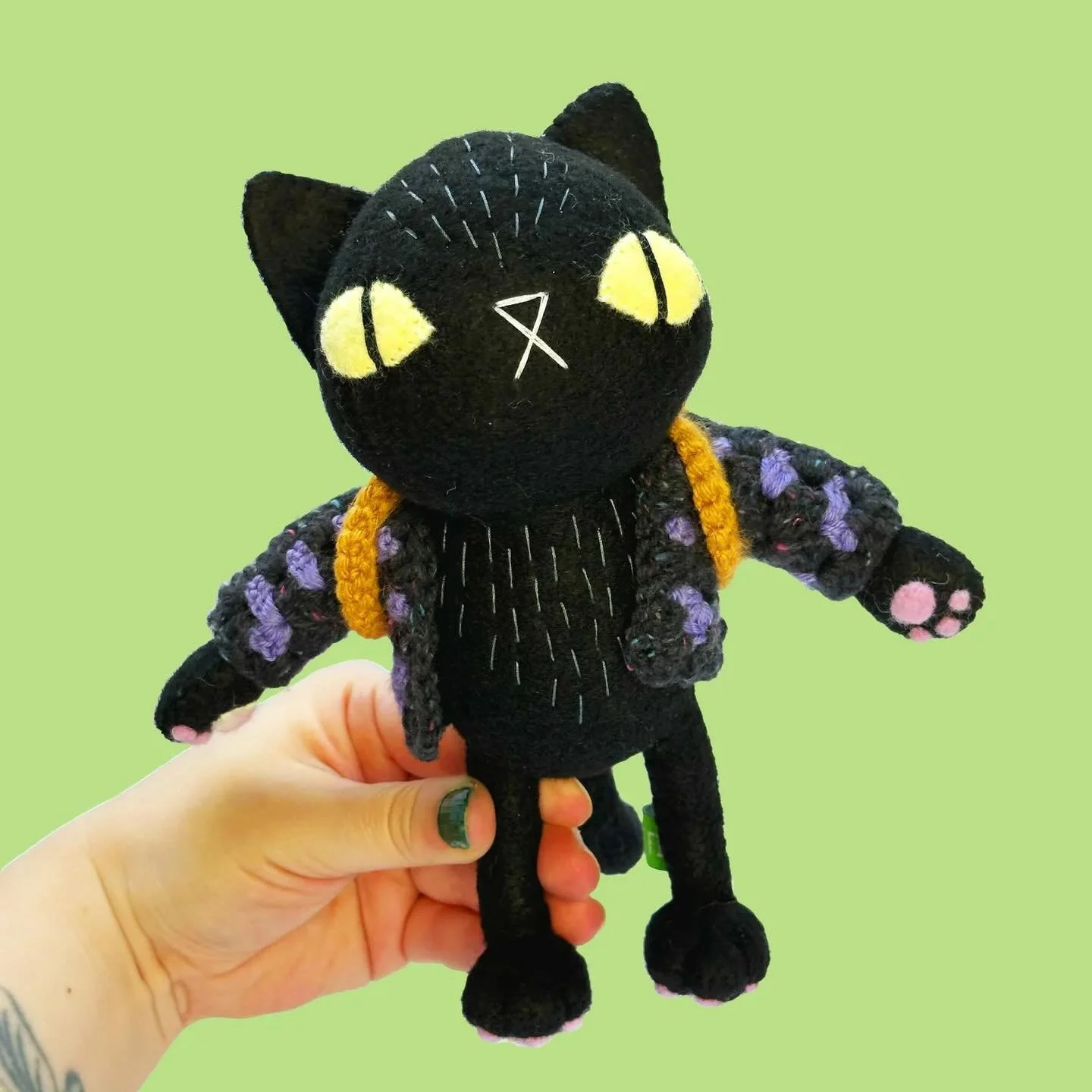 Back in action, baby! Finally getting back to photographing my backlog of plushies and first up is this cozy black cat rocking a purple granny sweater and backpack (with a surprise fishy treat!).

Link to the shop is in the bio. $85 USD + shipping

R
