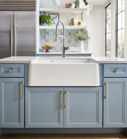 butler sink with light blue traditional cabinets