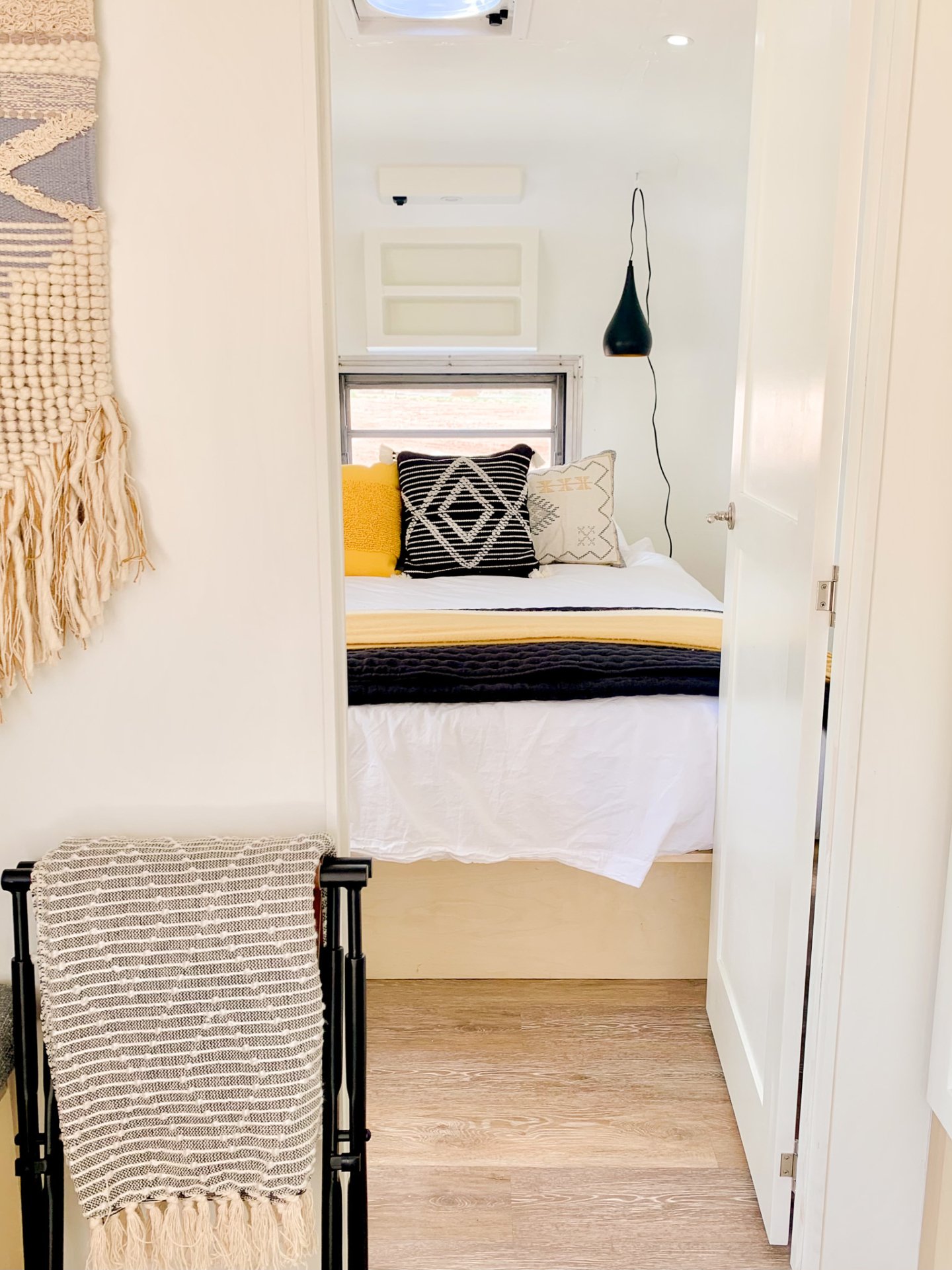 The tiny home&rsquo;s bed invites you to relax after a day in the wild. Put Camp Eddy at the top of your next glamping adventure.
