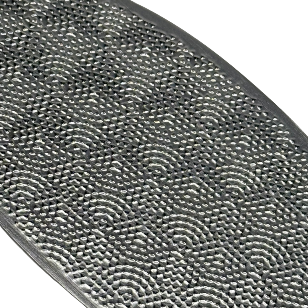 Close up of coarse abrasive pattern on Meticulous Manicurist foot file