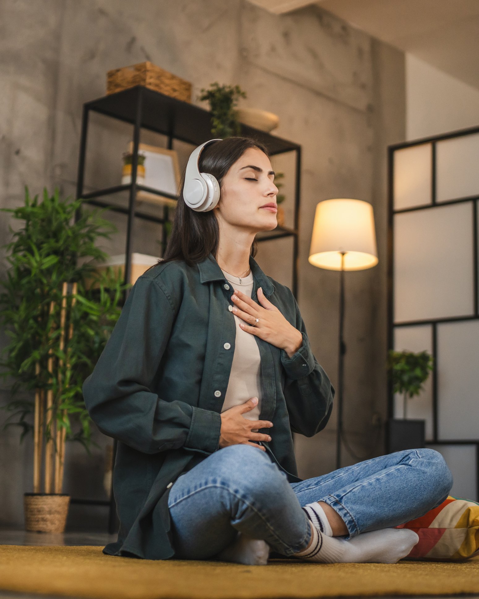 Person meditating with hands on heart, practicing mindfulness for anxiety and OCD therapy in Bergen County, NJ