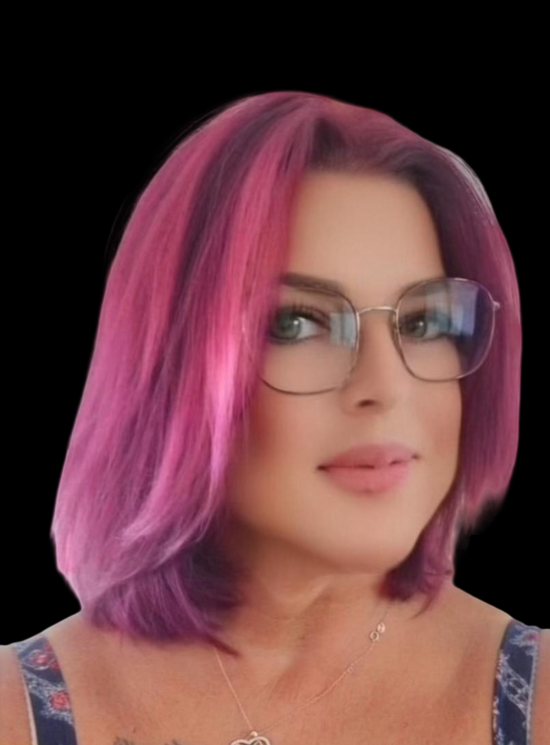 A woman with shoulder-length pink and purple hair, wearing glasses, a floral tank top, and a delicate necklace, against a black background.