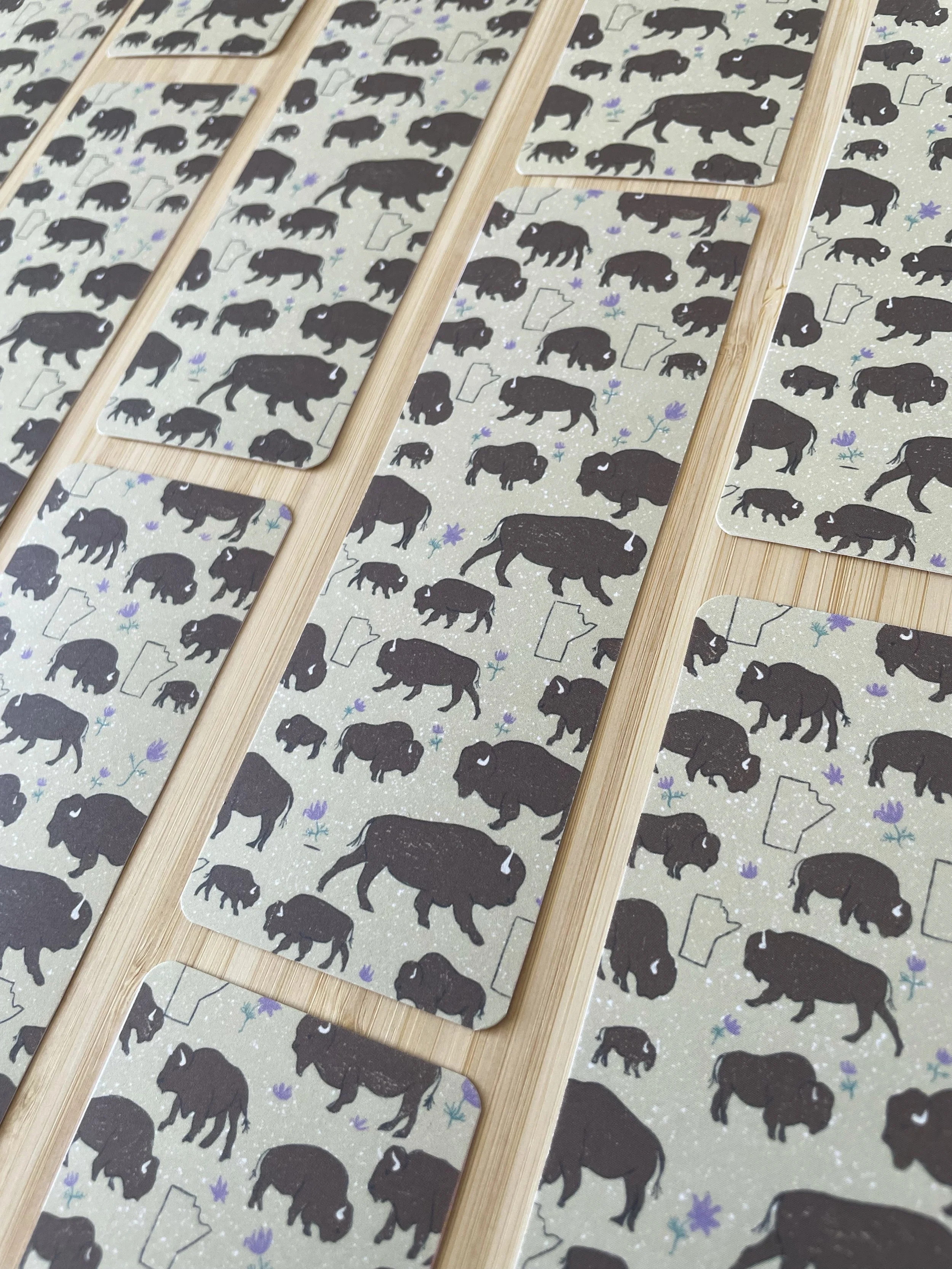 A collage of boomarks lies across a table.