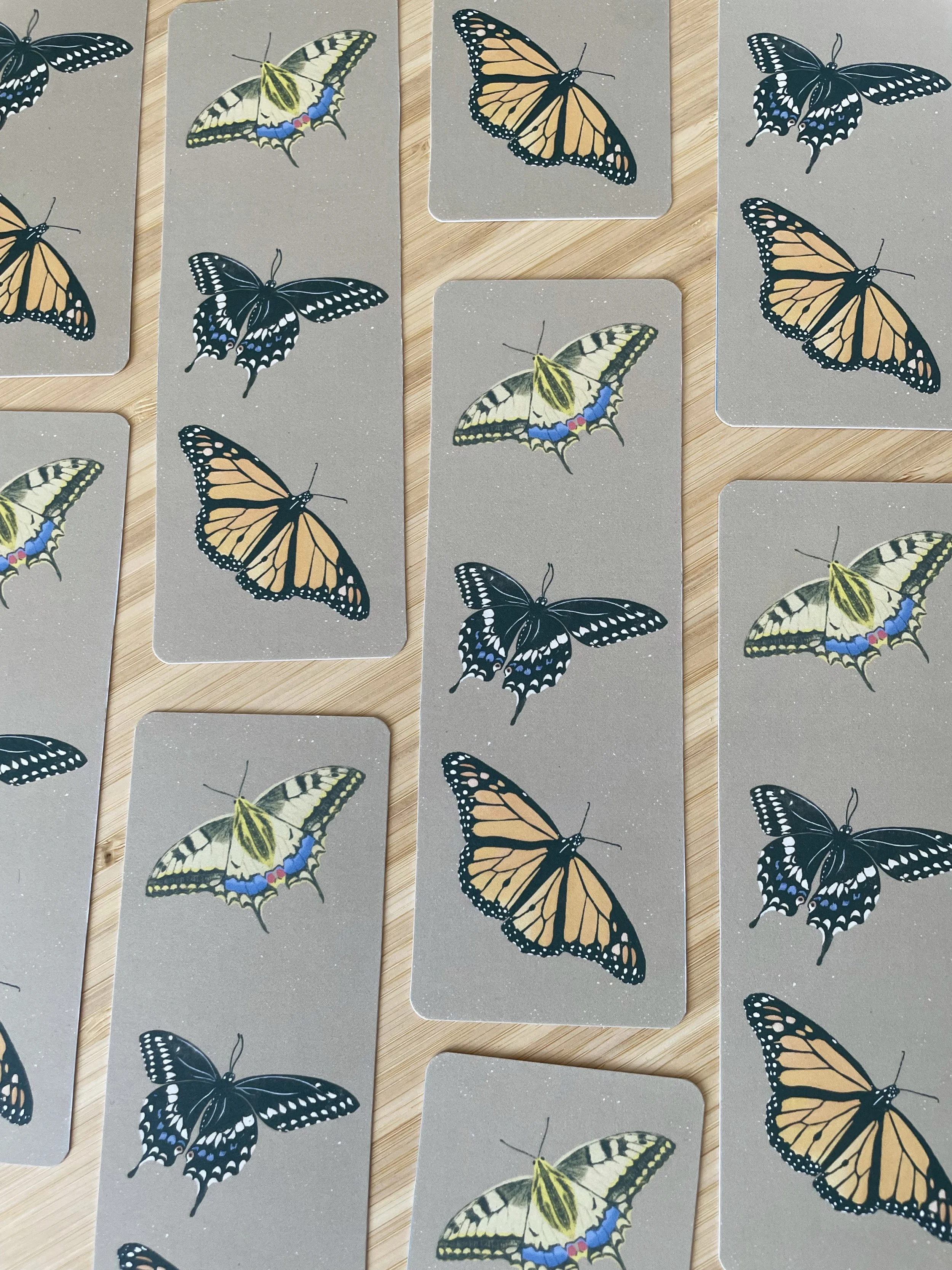 A collection of bookmarks featuring butterflies arranged in a offset grid.