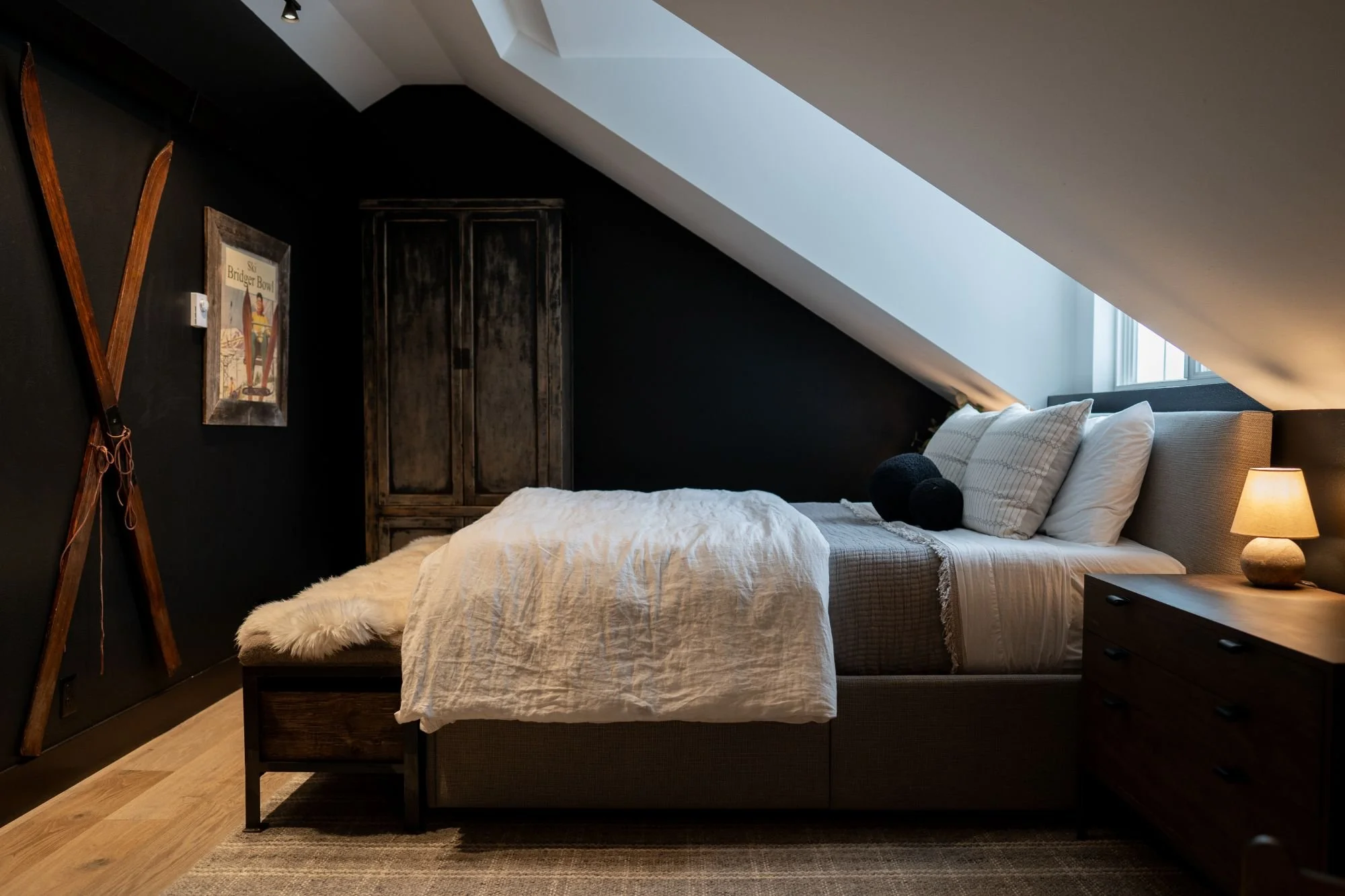 A workspace with fabric swatches, color samples, a dried lavender bouquet, and design materials on a beige bulletin board.