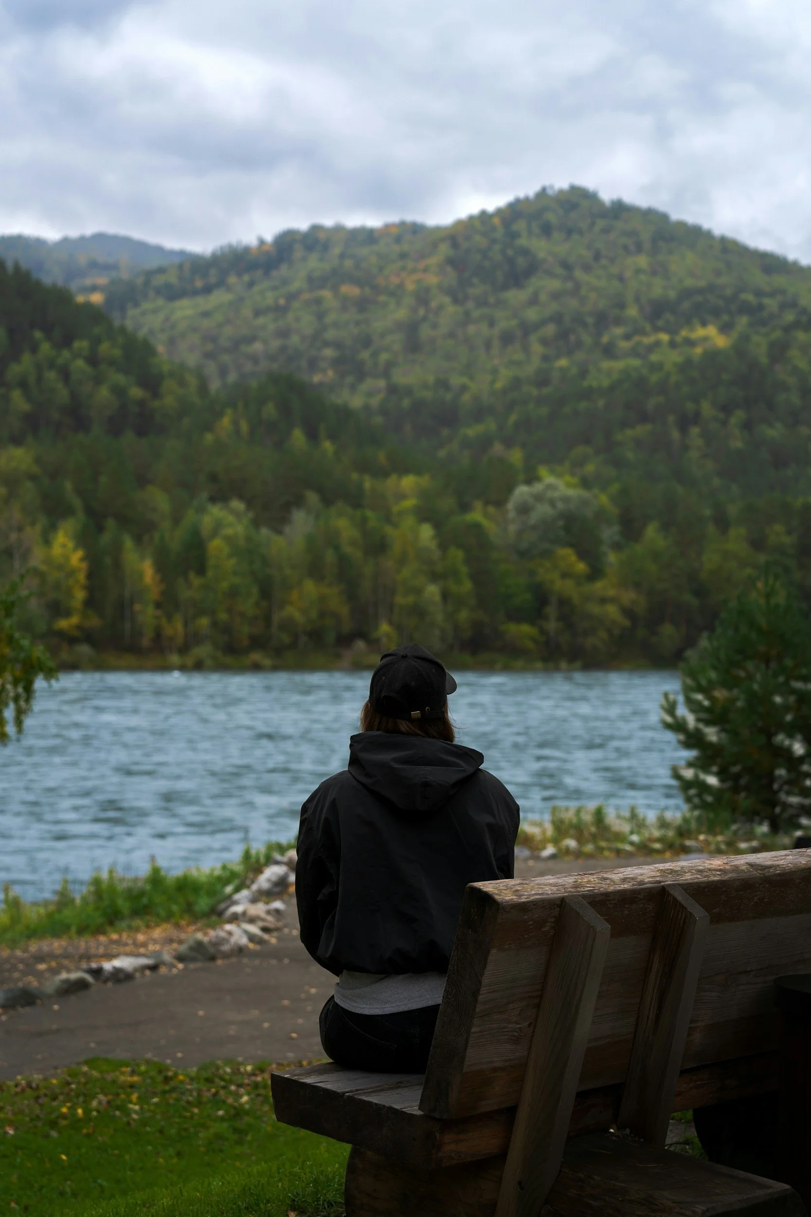 woman sitting on a bench in nature
