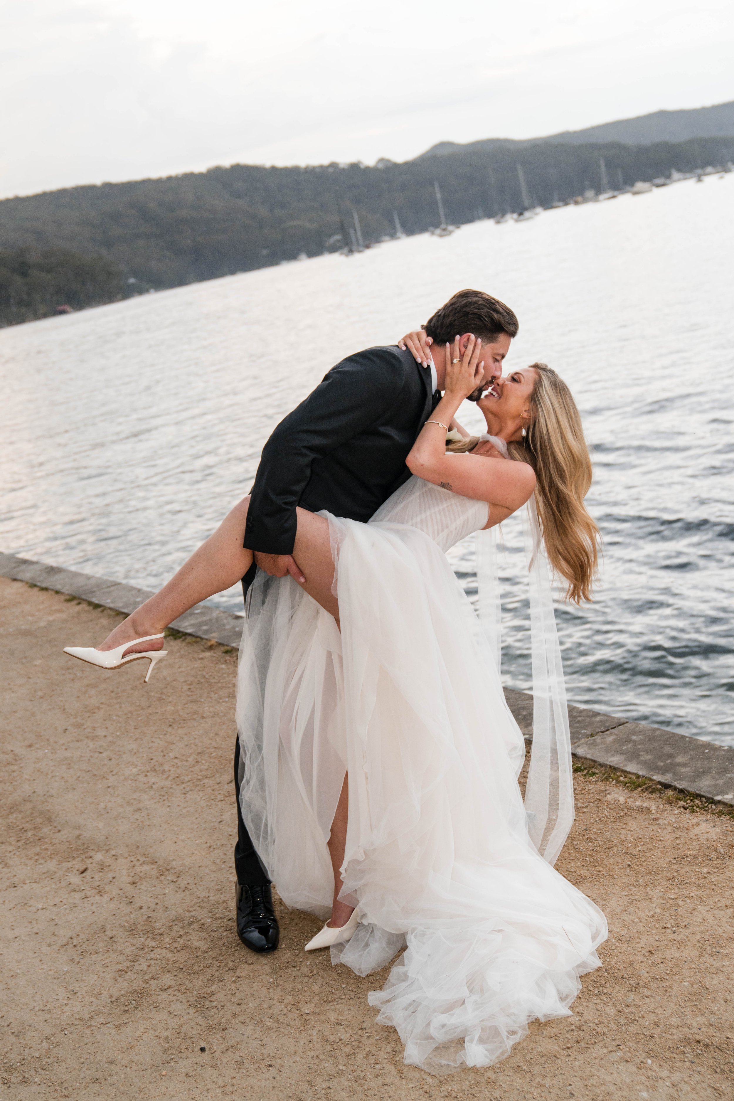A timeless Northern Beaches wedding celebration at Pasadena Sydney, featuring beautiful natural light and waterfront scenery. Chelsea and Jack celebrating their wedding at Pasadena, one of Sydney’s beautiful waterfront wedding venues on Pittwater.