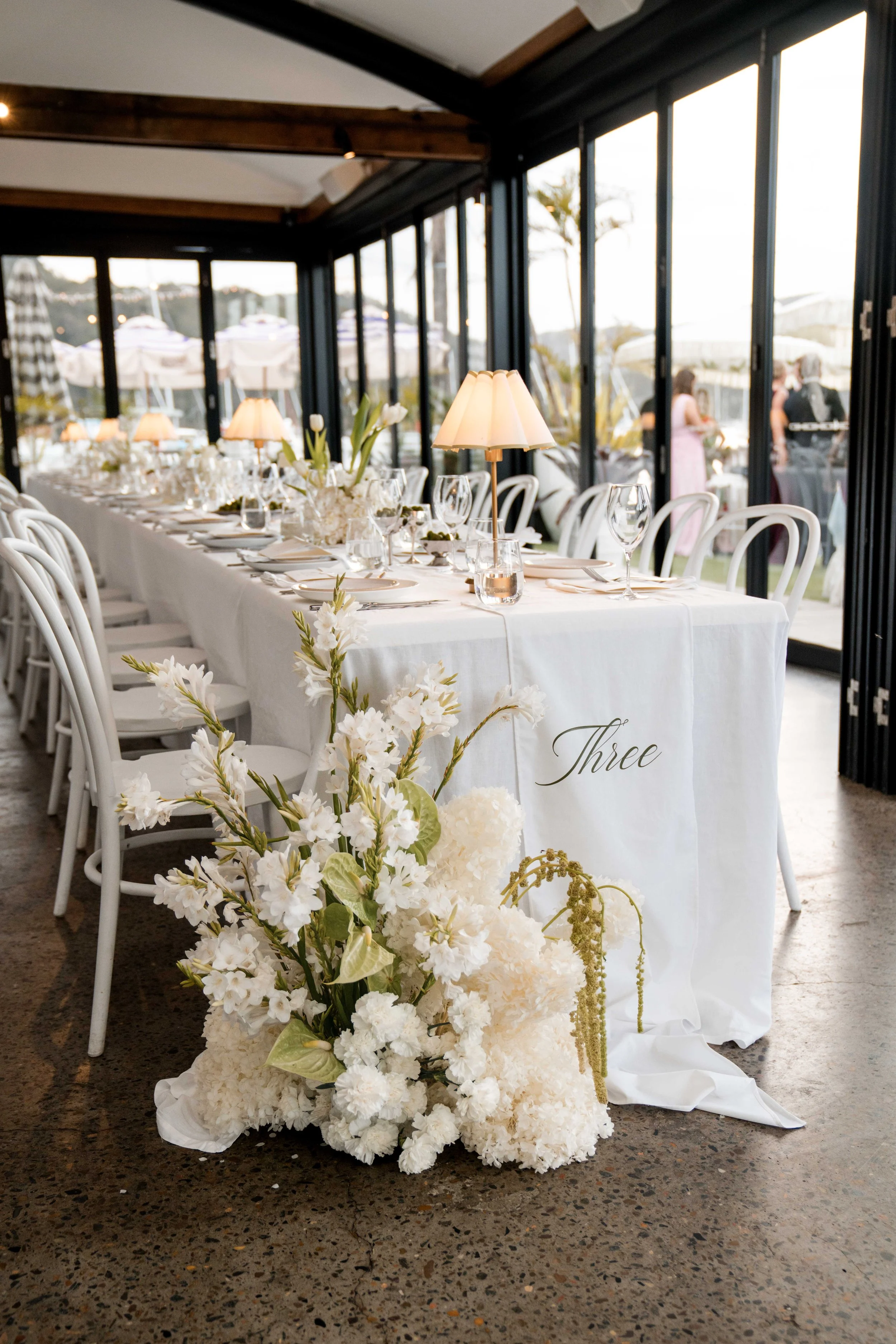 Chelsea and Jack celebrating their wedding at Pasadena, one of Sydney’s beautiful waterfront wedding venues on Pittwater.