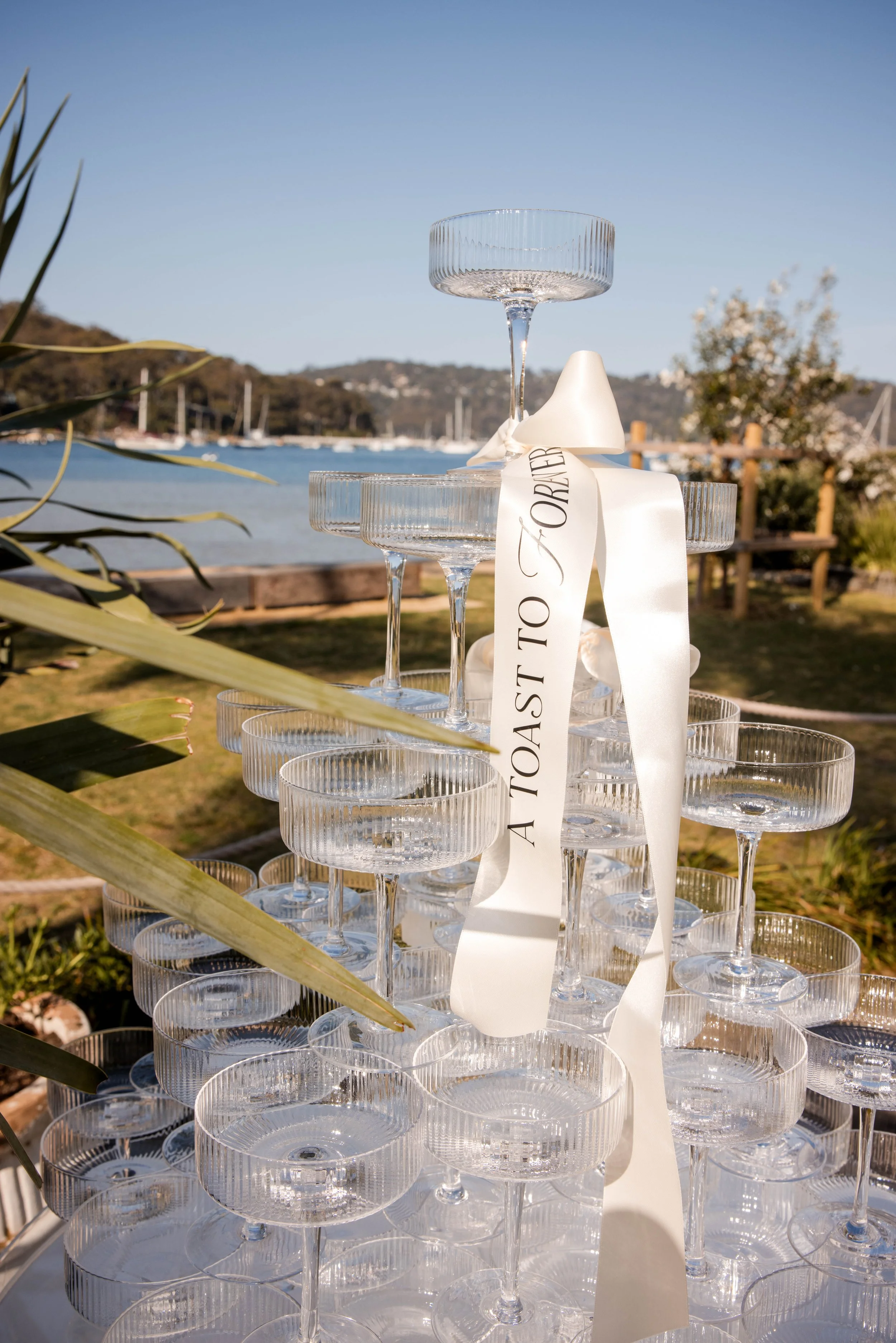 Chelsea and Jack celebrating their wedding at Pasadena, one of Sydney’s beautiful waterfront wedding venues on Pittwater.