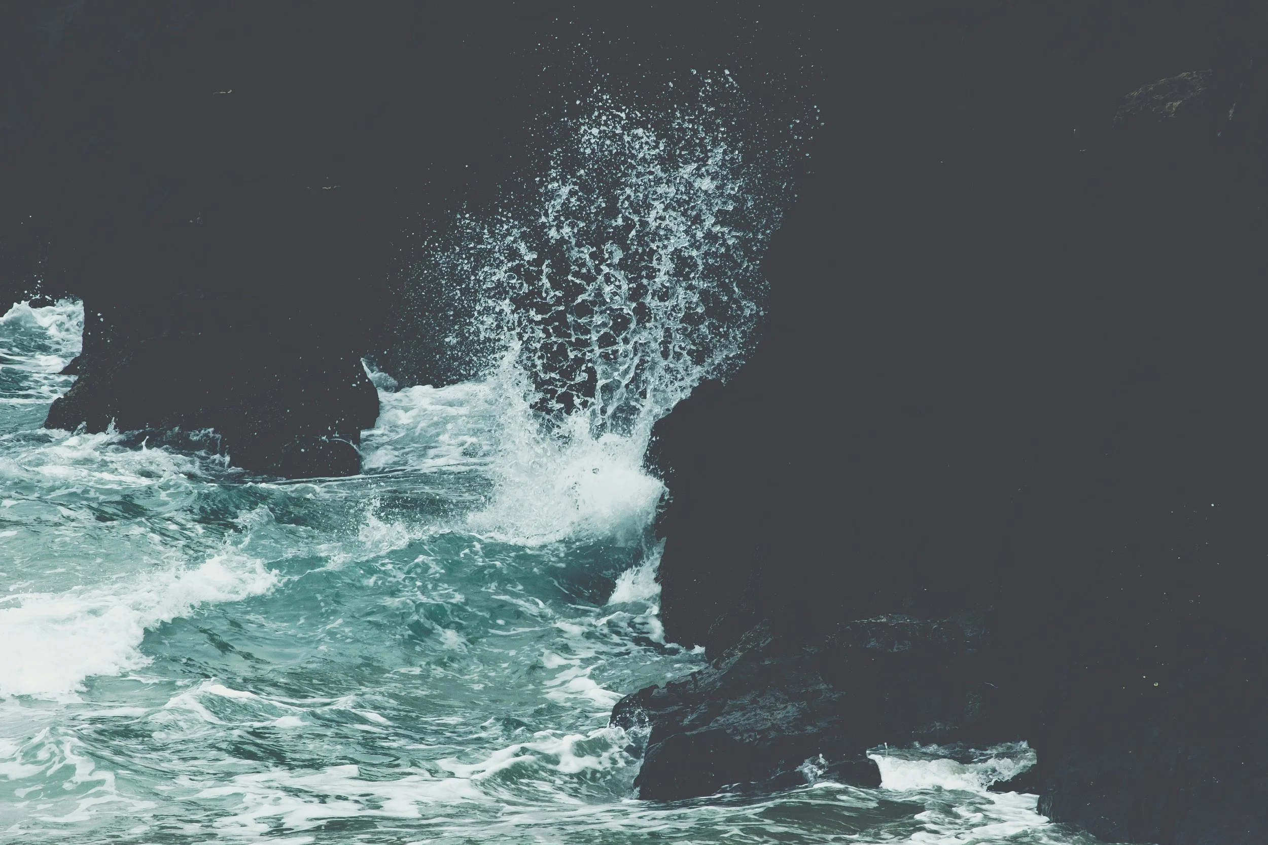 aleks-dahlberg-WMWF9WcDBOw-unsplash wave on black rocks.jpg