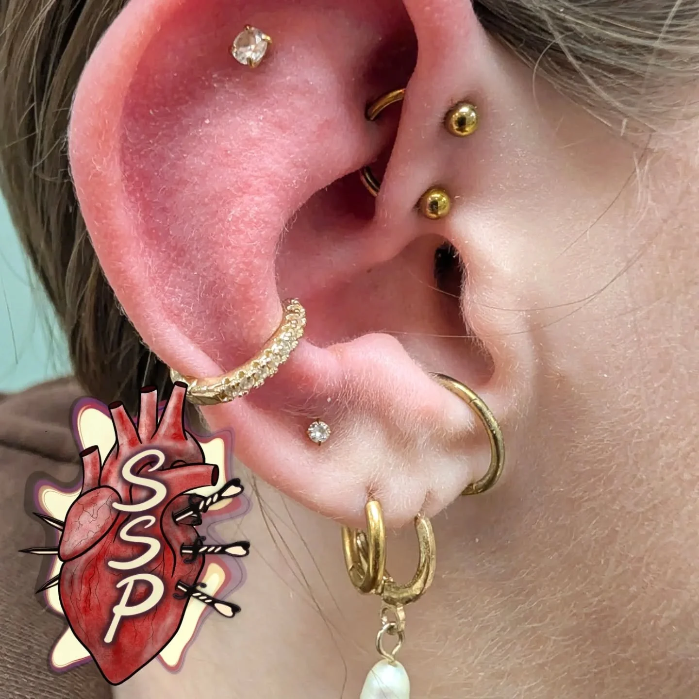 Super fun one today! I think I'ma call it a frook. Unless it already has a name then please let me know but I think frook works. Double forward helix and rook piercing with a titanium horseshoe to finish the look. 

If you're interested in coming in 