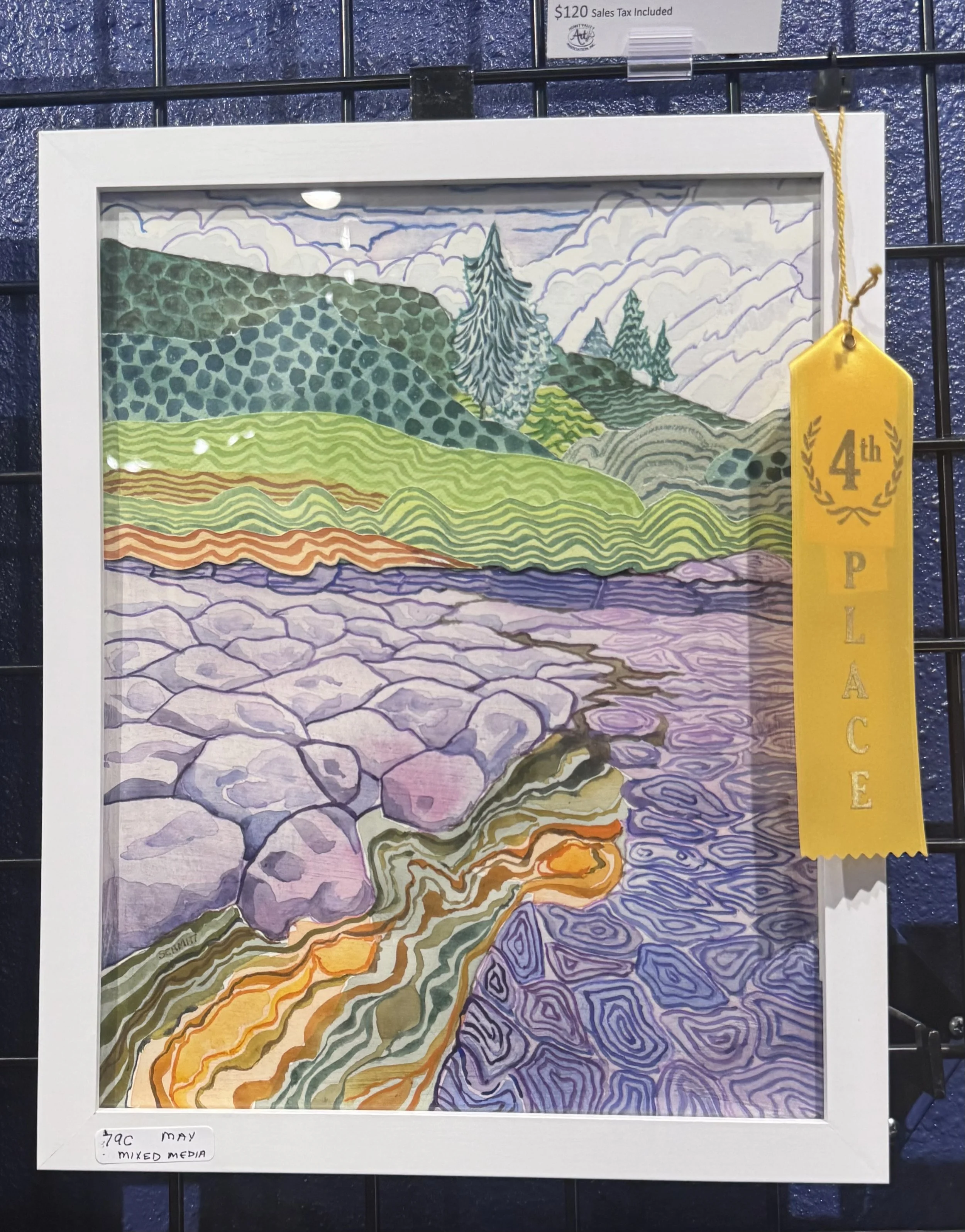 Colorful landscape drawing with mountains, trees, and valleys in a layered, abstract style, displayed in a white frame with a yellow ribbon that reads '4th PLACE' attached to the top right corner.