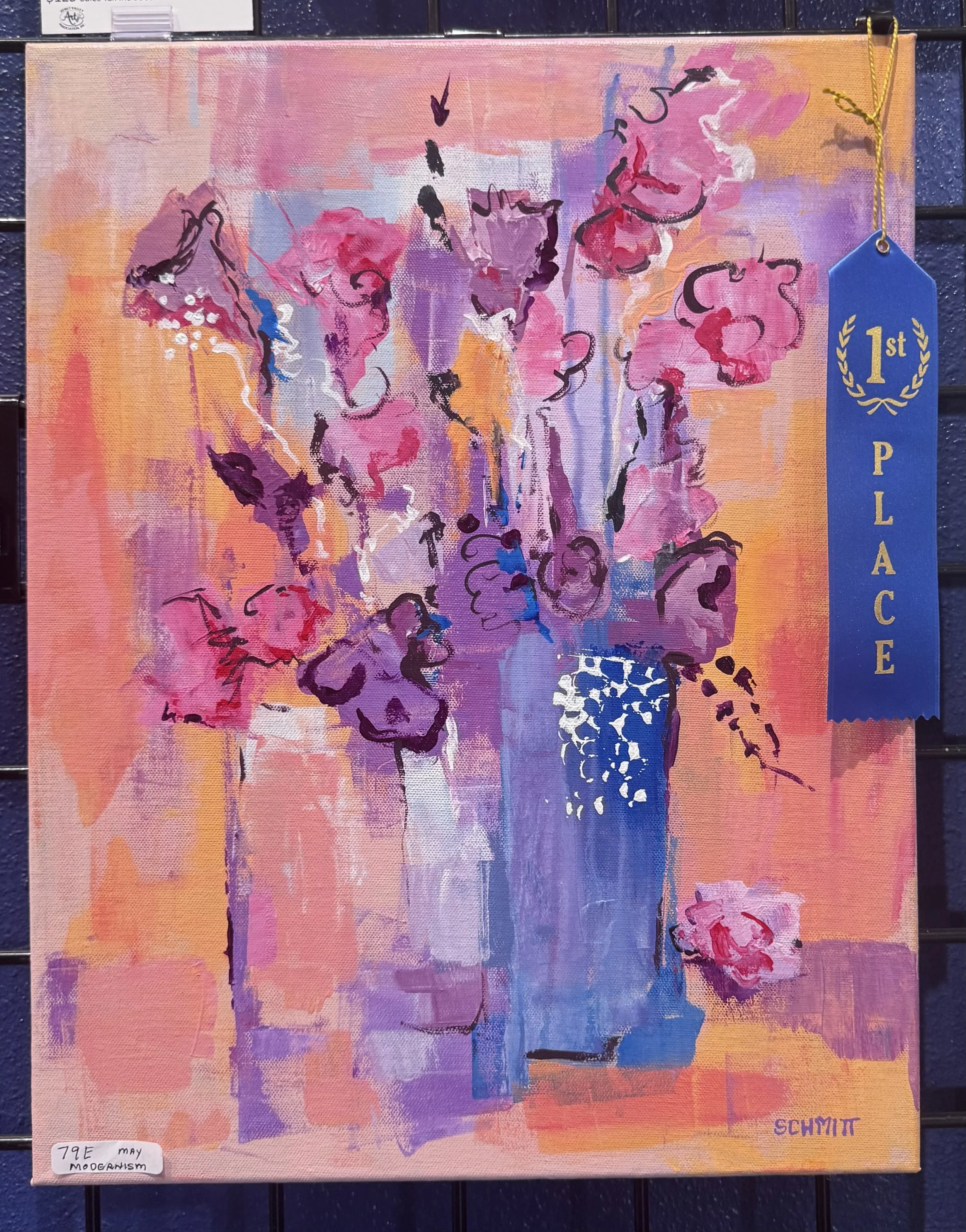 Abstract painting with vibrant pink, purple, orange, and blue hues, featuring loose, expressive brushstrokes and a woman silhouette with flowing hair and a dress with a pattern, signed by Schmitt.