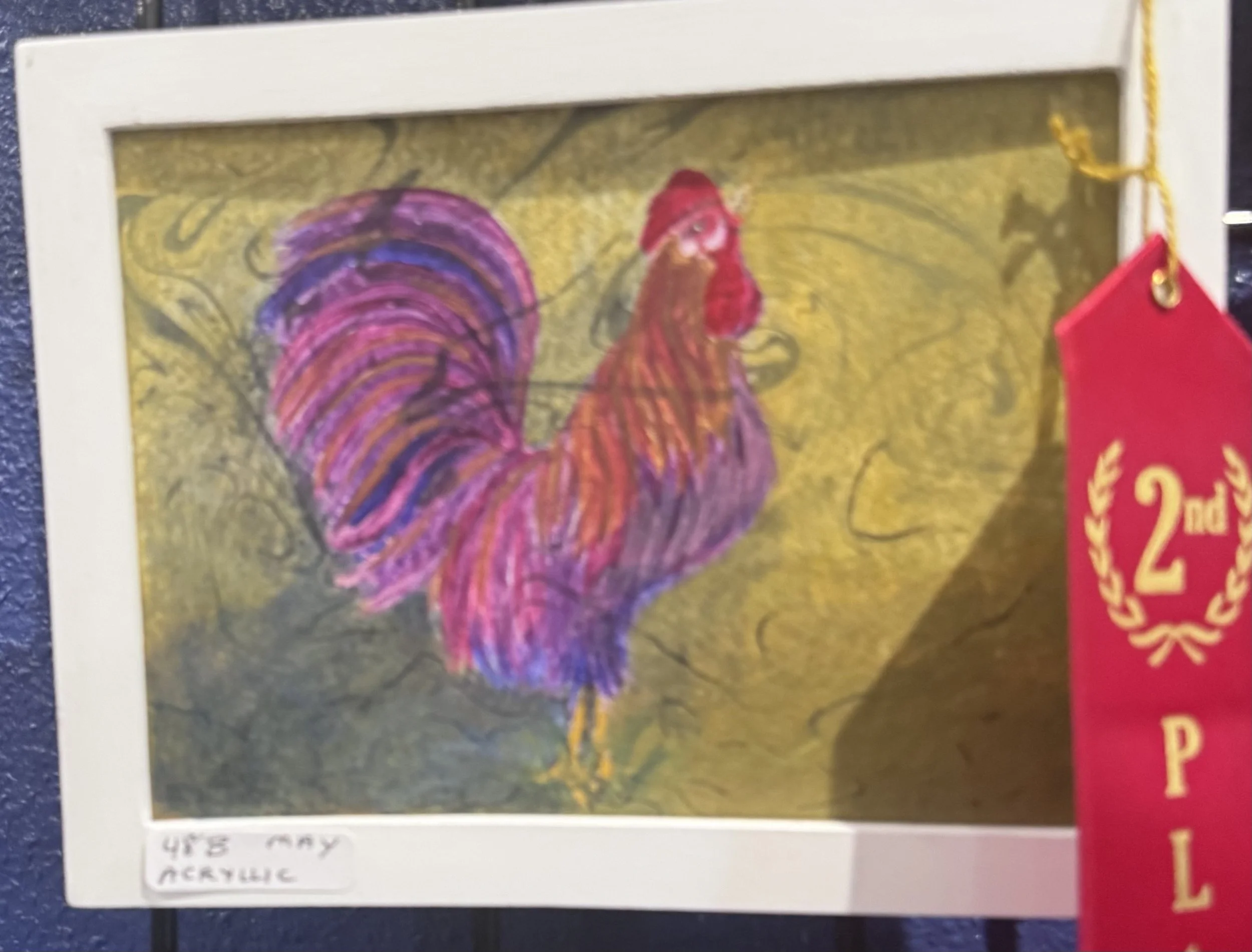 A colorful drawing of a rooster with purple and red feathers, a red crown, and a yellow beak, with a yellow background and black lines.