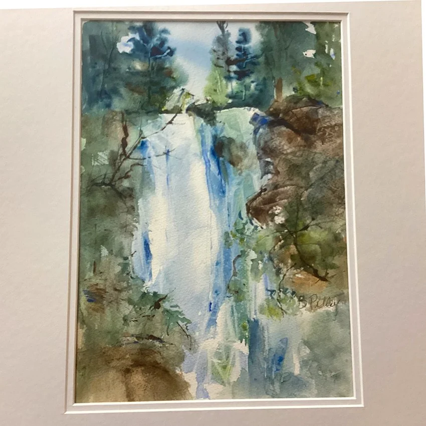 Watercolor painting of a waterfall in a forest with rocks and greenery.