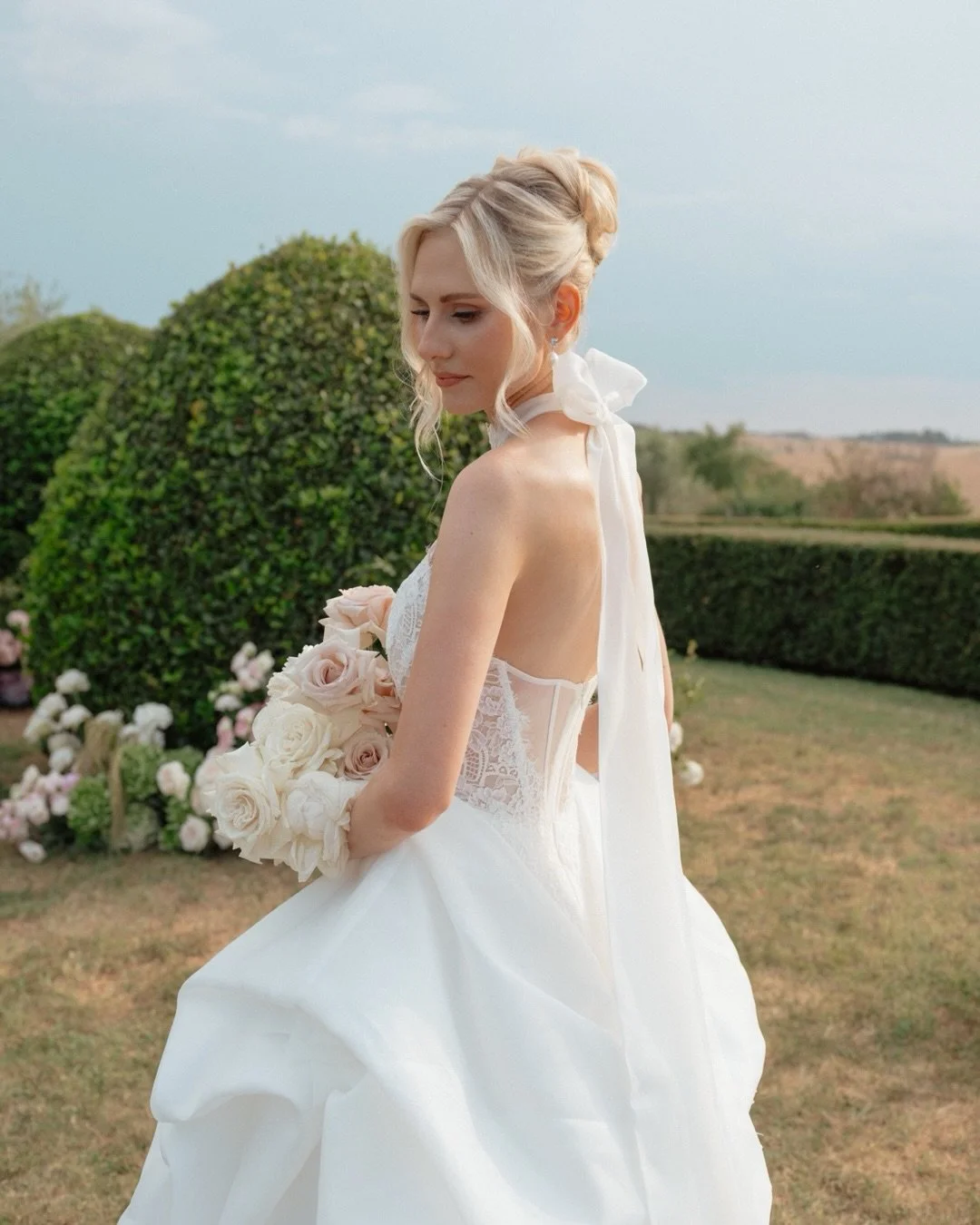 Some brides wear a gown. 
Vicky wore a story &mdash; lace like breath, a bow undone by wind, a train that knew exactly how to fall.
She moved through that Tuscan light like she&rsquo;d always belonged to it.

Jonathan + Vicky, Summer of &lsquo;26. Tu