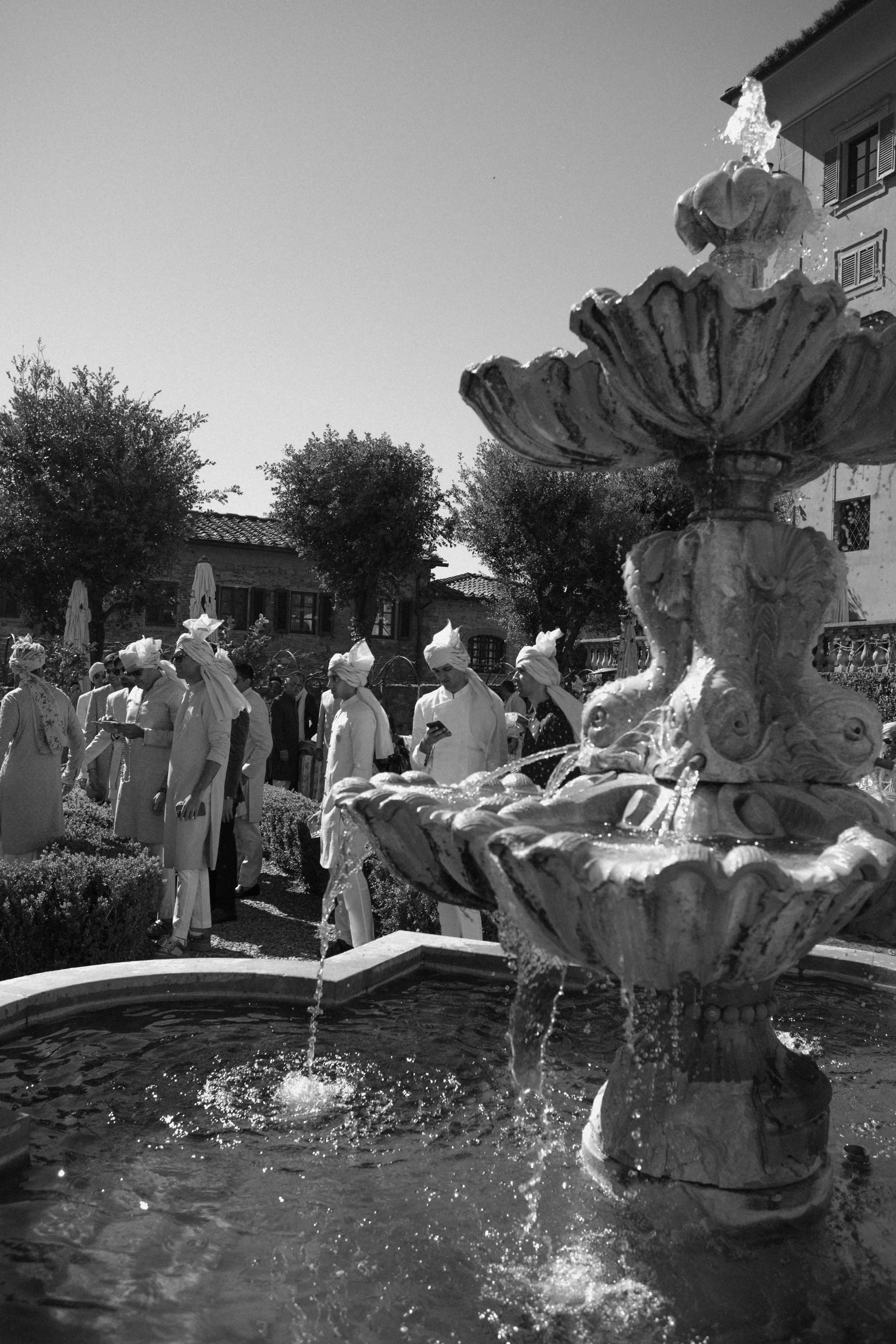 sahil-aashna-luxury-indian-wedding-il-borro-tuscany-black-and-white-fountain-garden-scene.jpg
