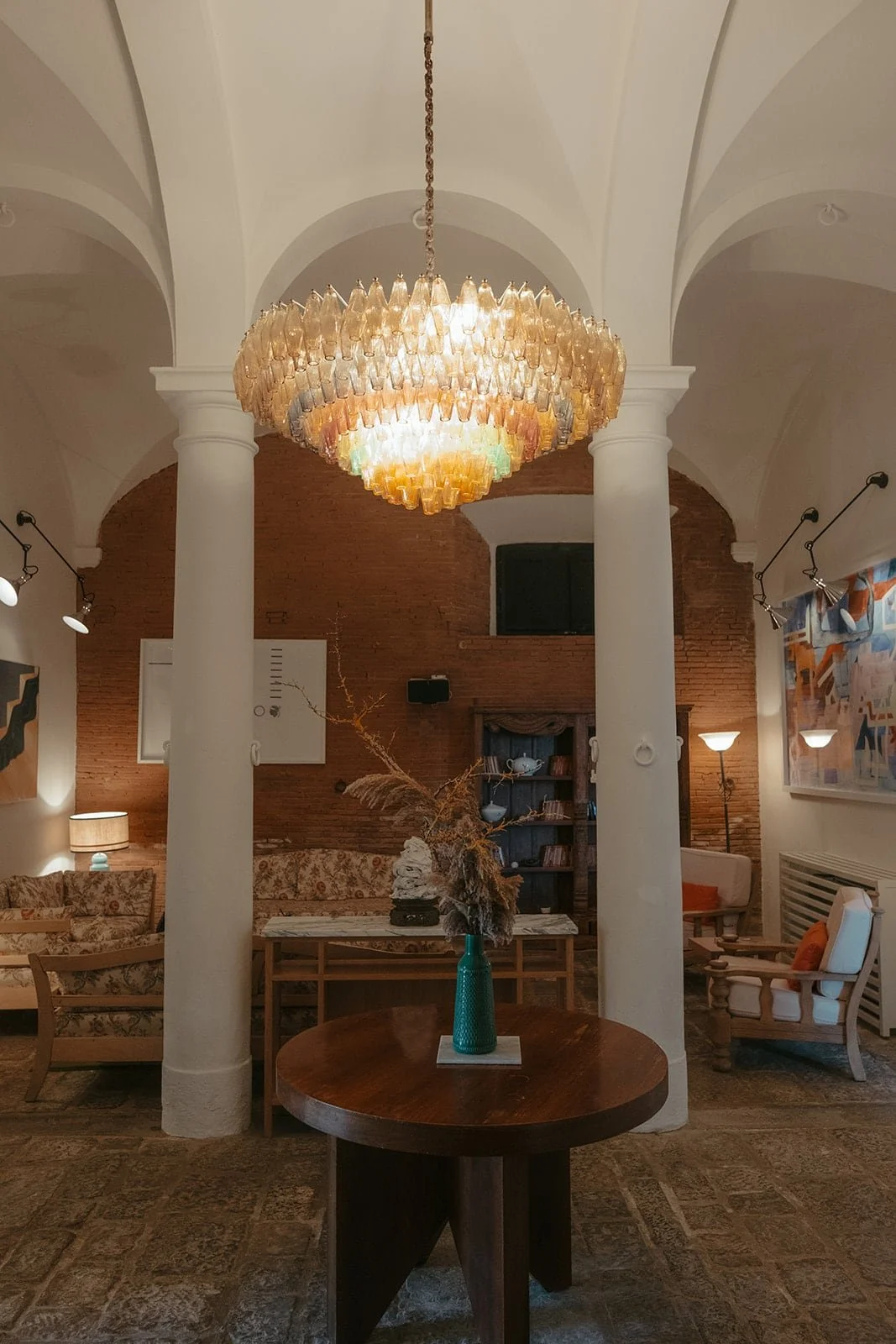 Elegant interiors at Villa Lena, featuring historic arches and soft evening light in a refined Tuscan wedding setting.