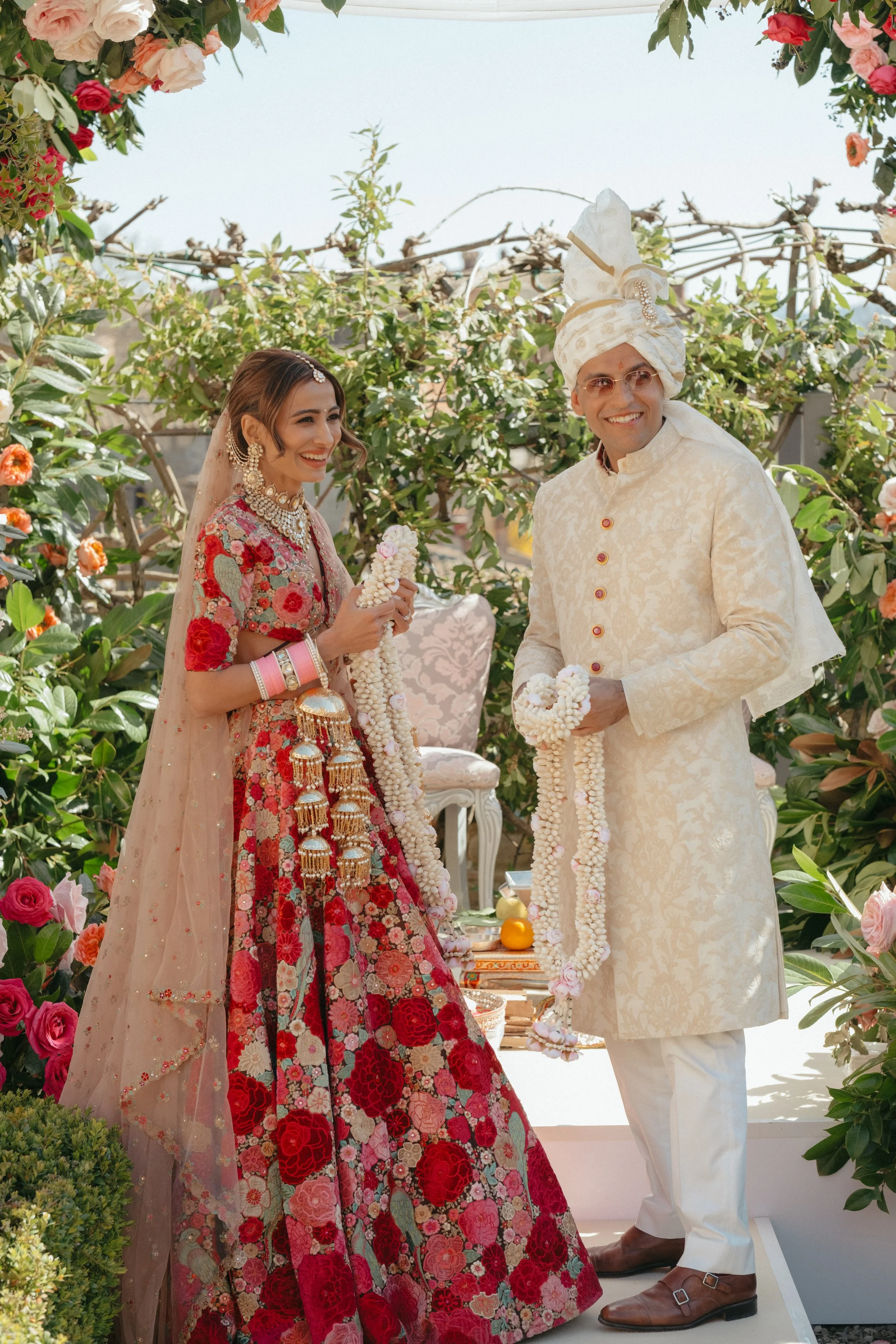 sahil-aashna-luxury-indian-wedding-il-borro-tuscany-bride-and-groom-garland-ceremony.jpg