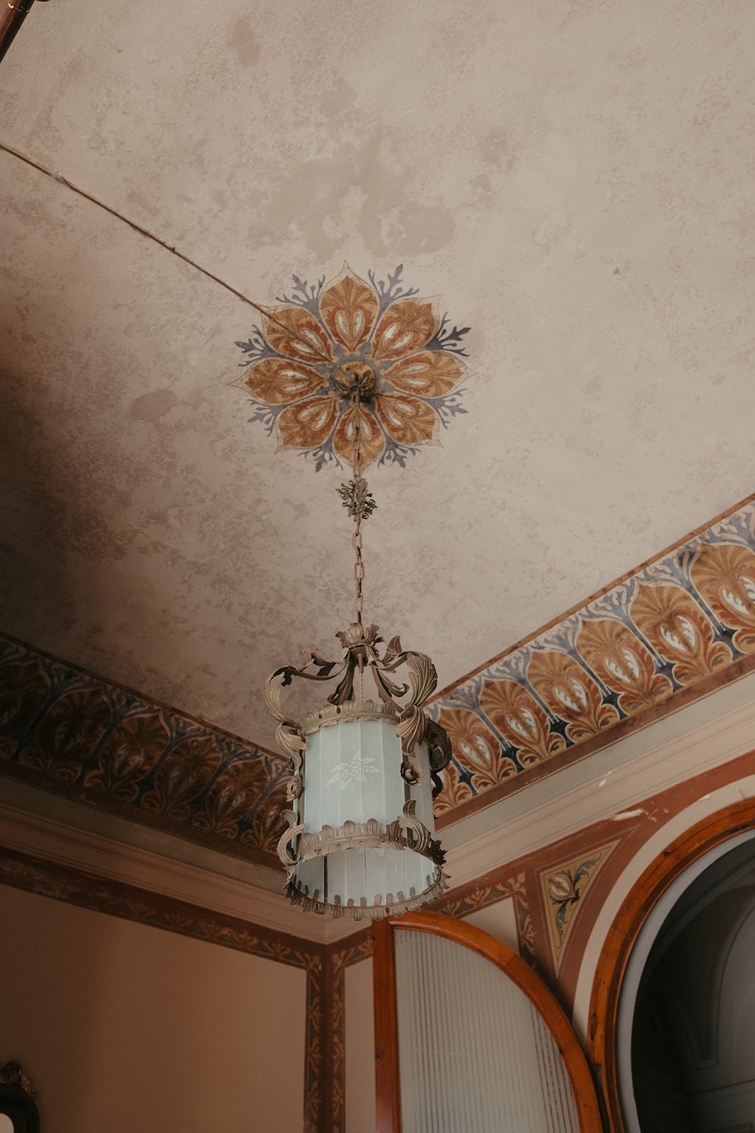 Painted ceilings and period details inside Villa Lena, reflecting the artistic soul of this Tuscan wedding venue.
