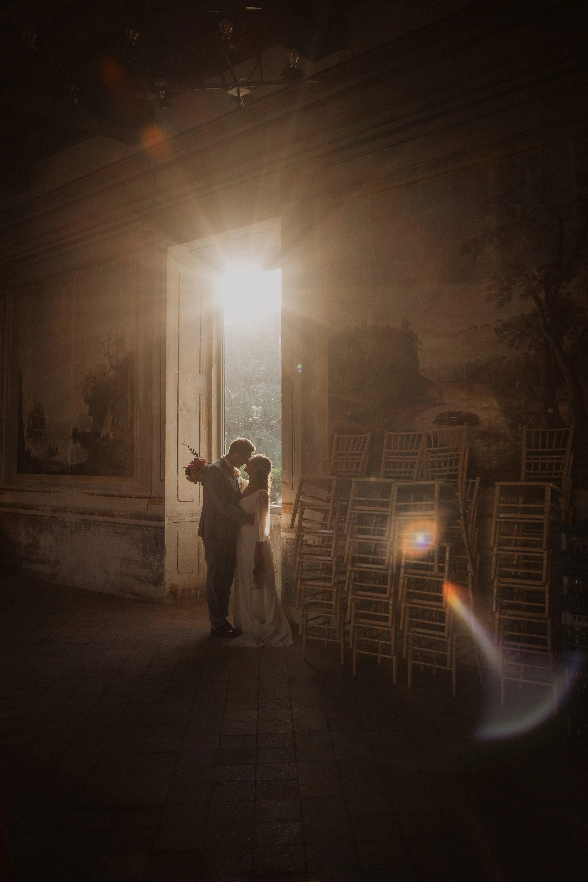 An intimate wedding portrait at Castello Cenci, capturing a refined couple bathed in natural light inside one of Rome’s most exclusive historic villas.