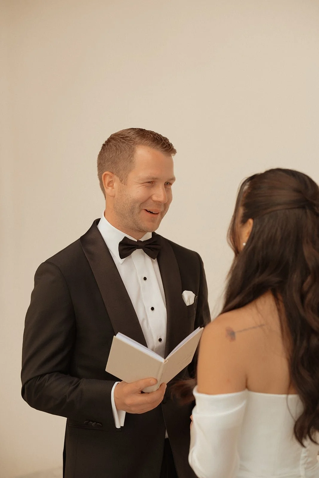 The groom reads his vows during an intimate ceremony inside Villa Lena, photographed in soft natural light with a calm and emotional atmosphere.