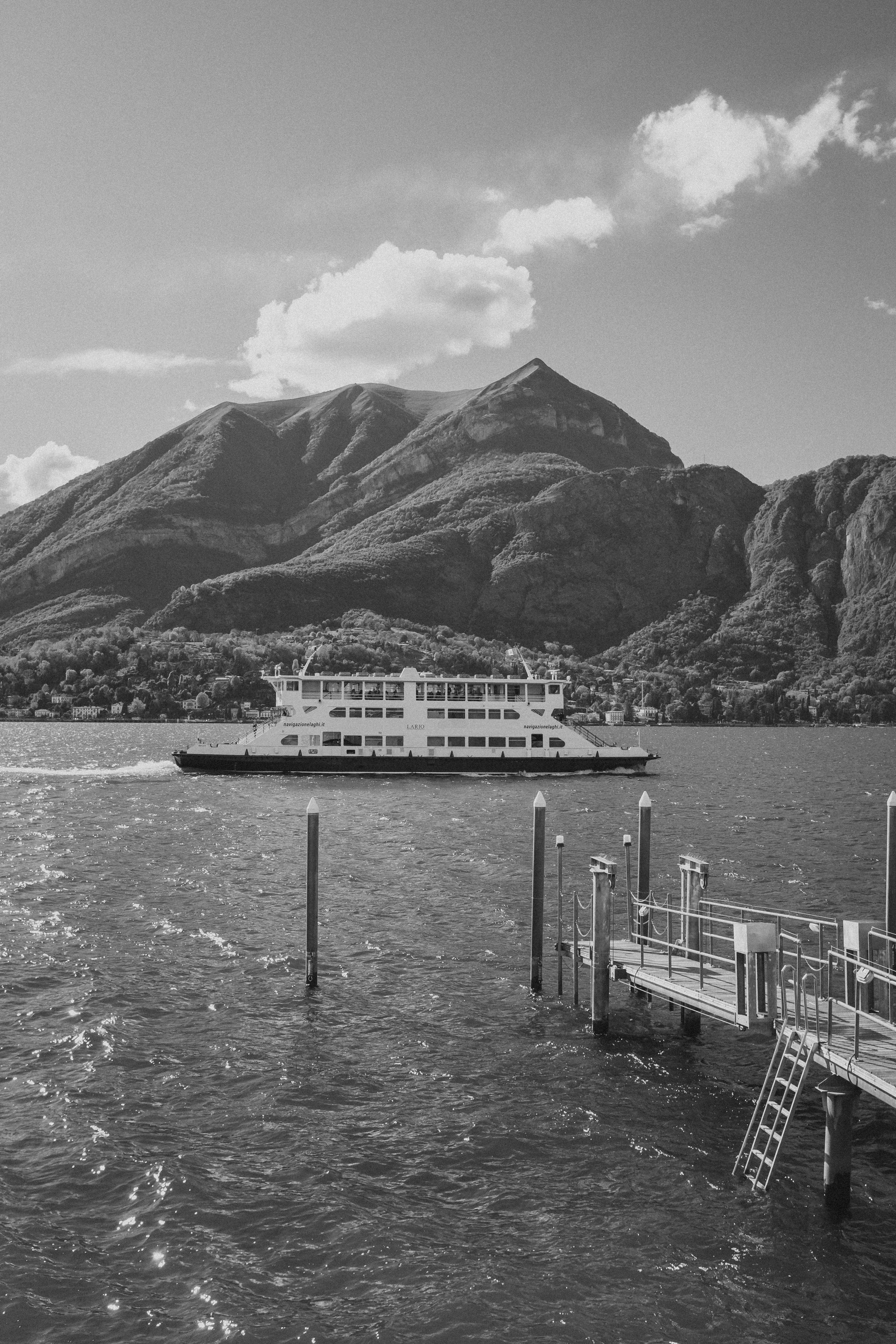 Boat Ride on Lake Como with Scenic Mountain Views | Luxury Destination Wedding Photography