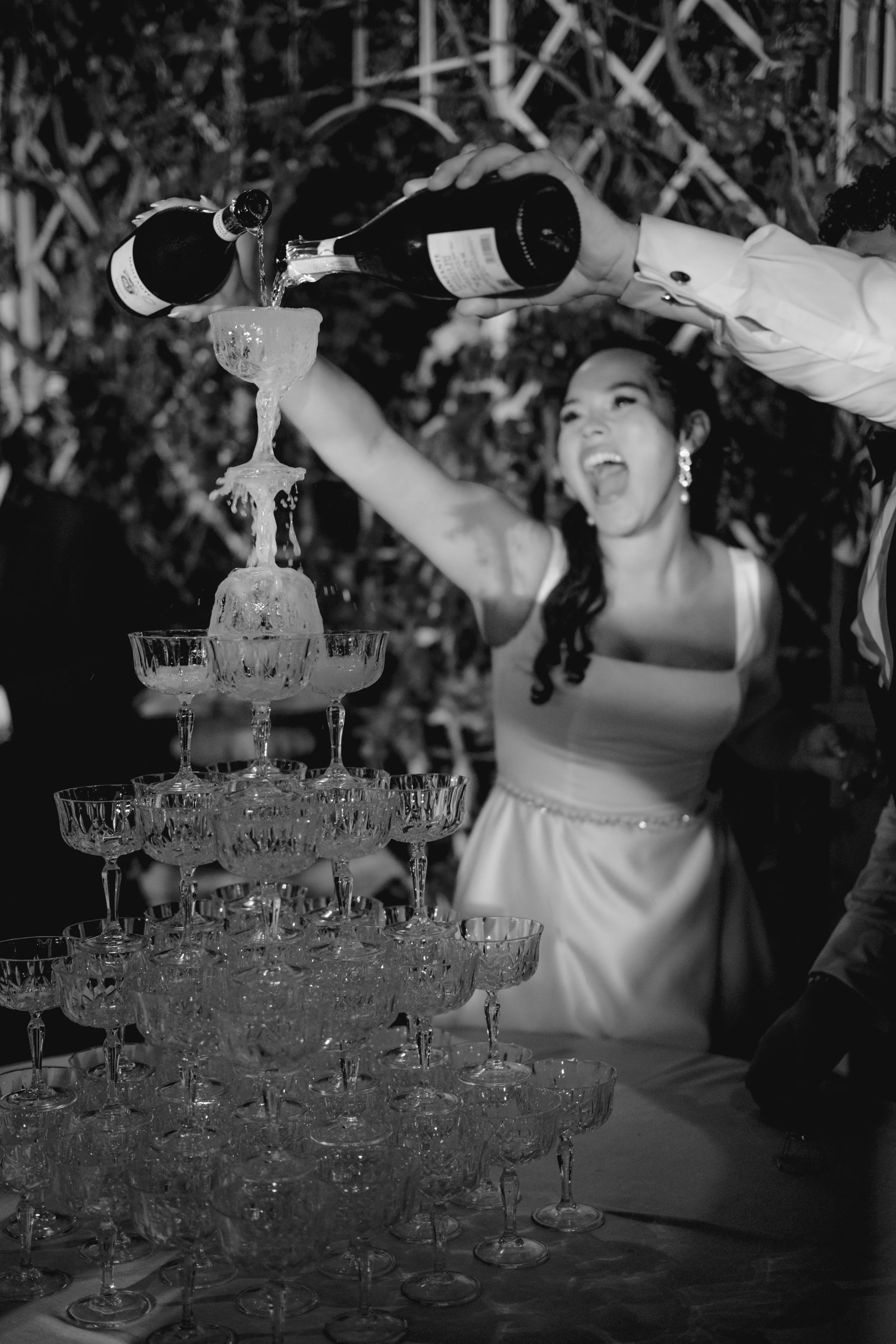 A joyful wedding celebration in Tuscany, capturing spontaneous energy, champagne toasts, and timeless black-and-white storytelling.
