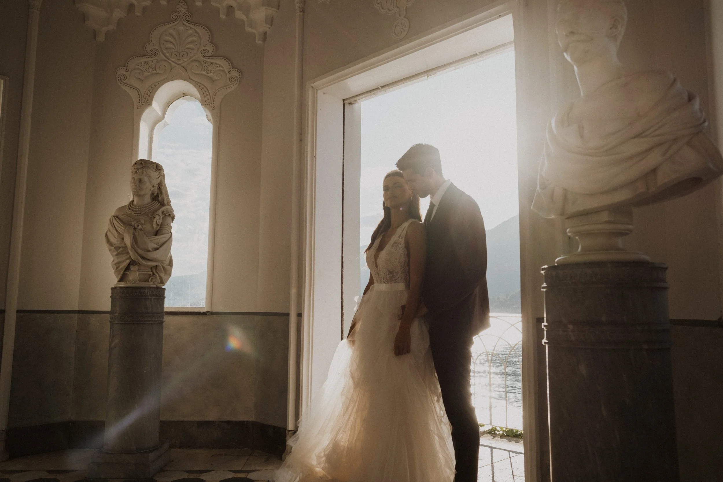 Luxury wedding photography at Villa Melzi, Lake Como. An intimate, light-filled moment blending Italian architecture, landscape, and timeless elegance.