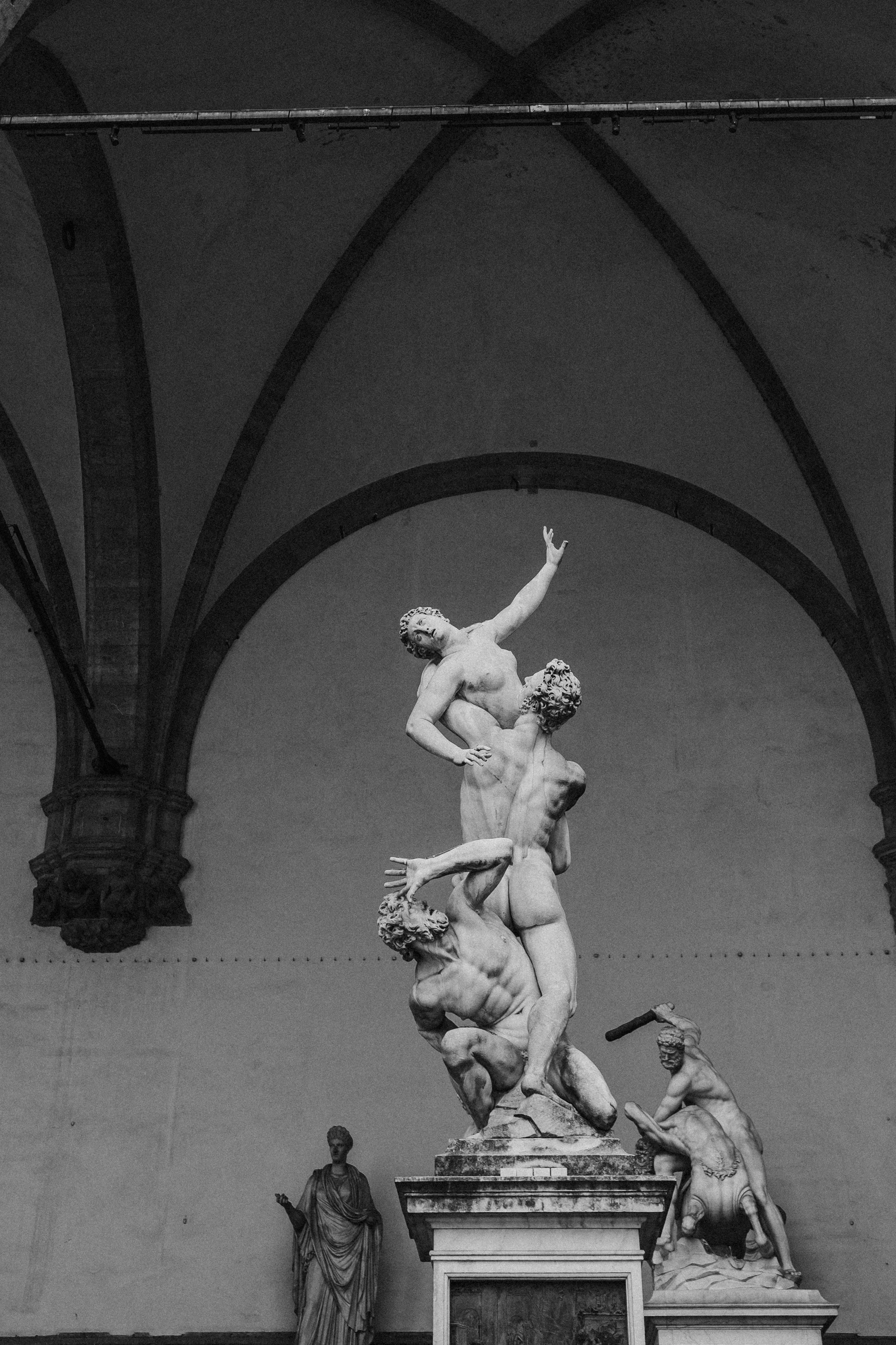 Historic Italian interior featuring classical sculpture and architectural symmetry, ideal for luxury weddings and refined editorial events.