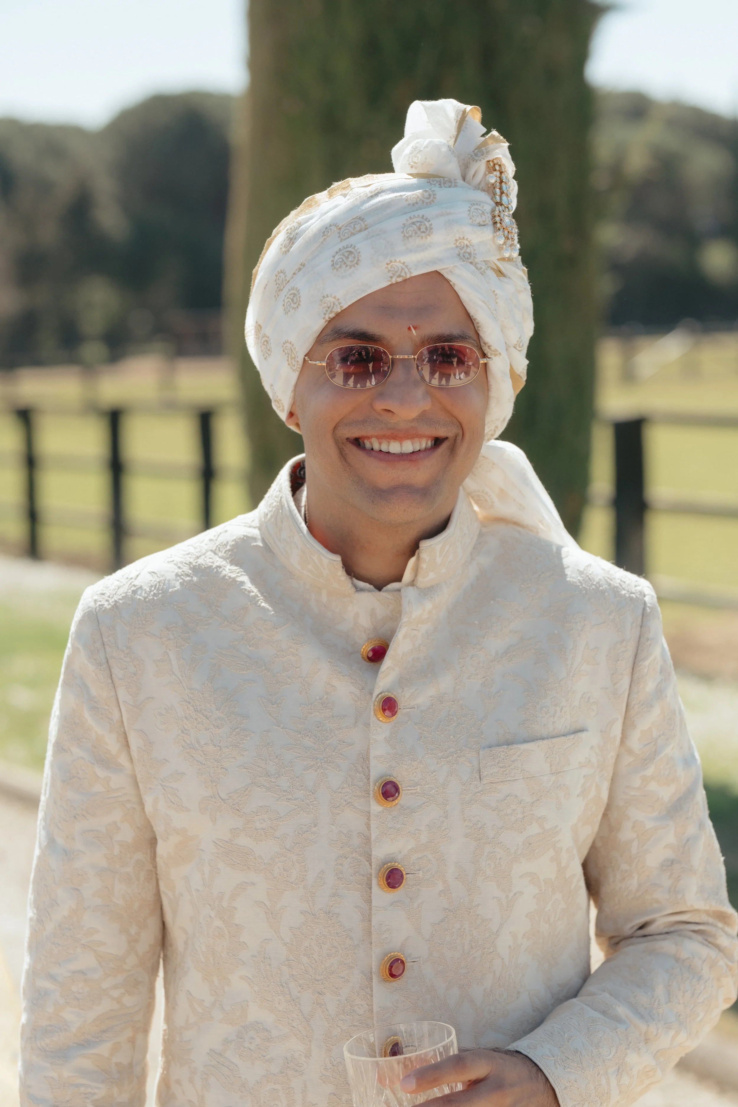 aashna-sahil-luxury-indian-wedding-il-borro-tuscany-groom-smiling-portrait.jpg