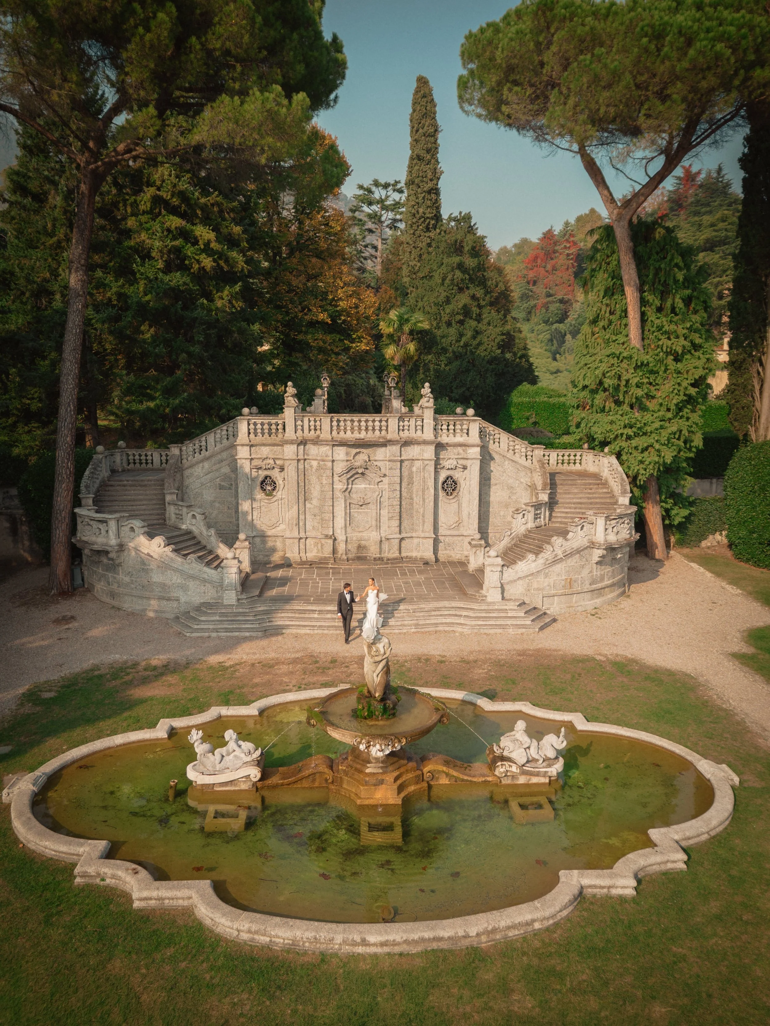 A refined Lake Como elopement set within a historic Italian garden, featuring grand stone staircases, sculpted fountains, and timeless elegance for an intimate wedding in Italy.