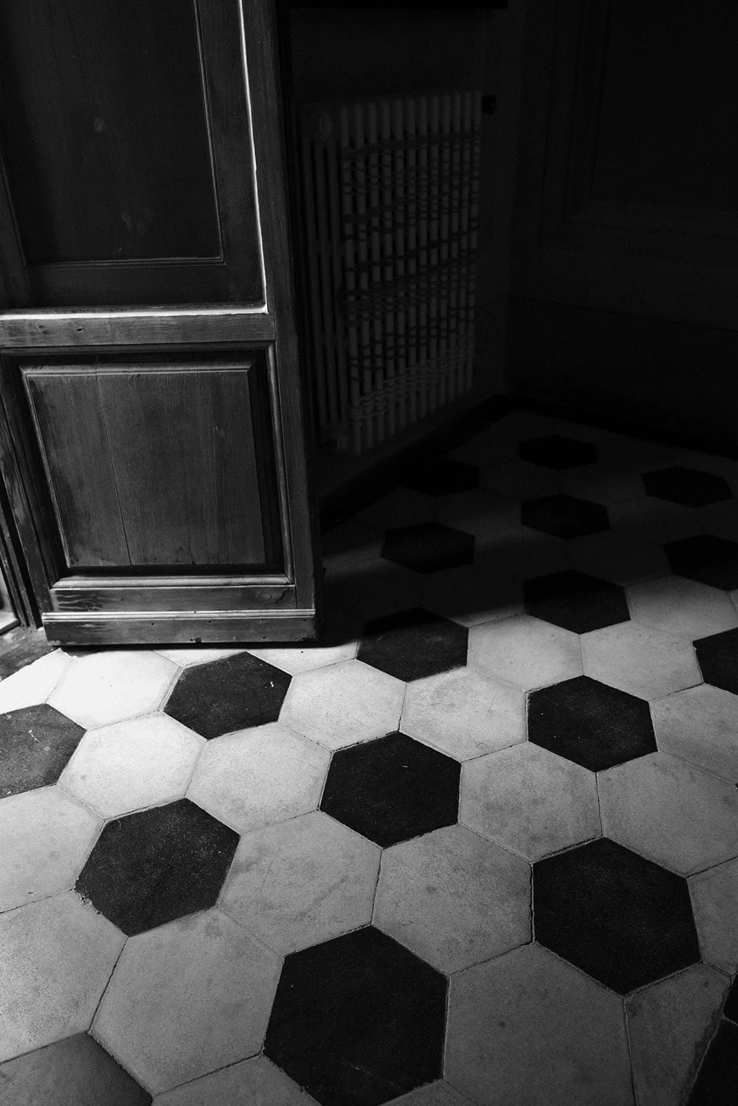 Moody black and white architectural detail inside Villa Lena, highlighting texture, shadow, and timeless Italian design.